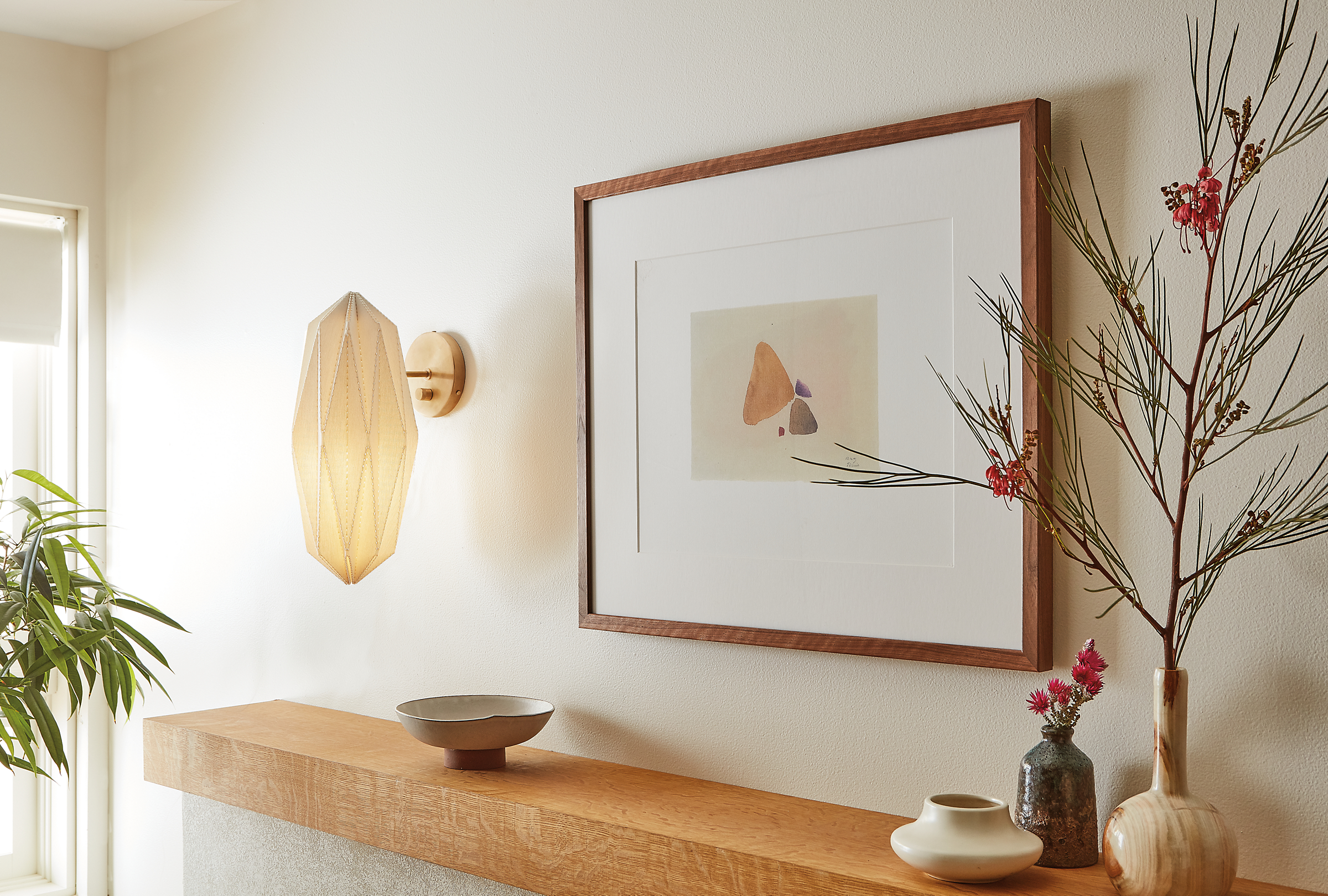 Living room with Orikata wall sconce in ivory linen.