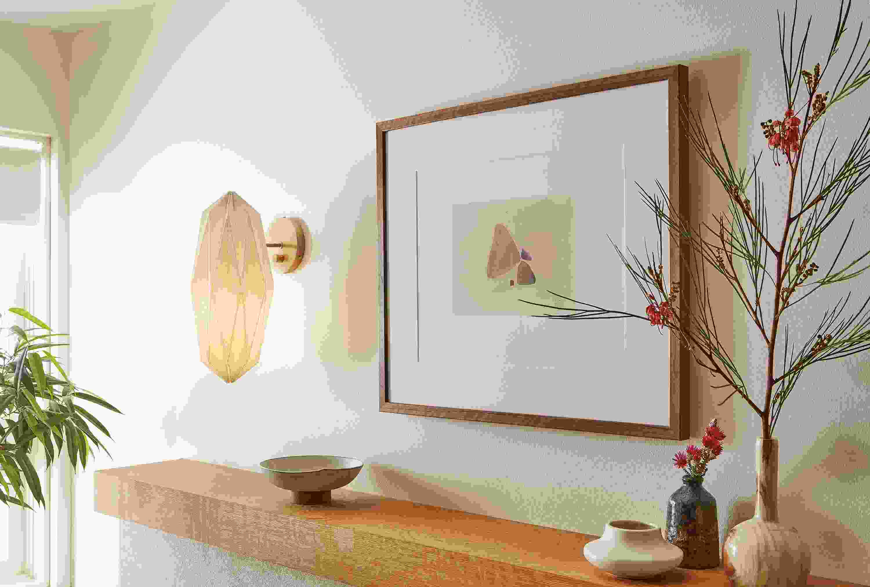 Living room with Orikata wall sconce in ivory linen.