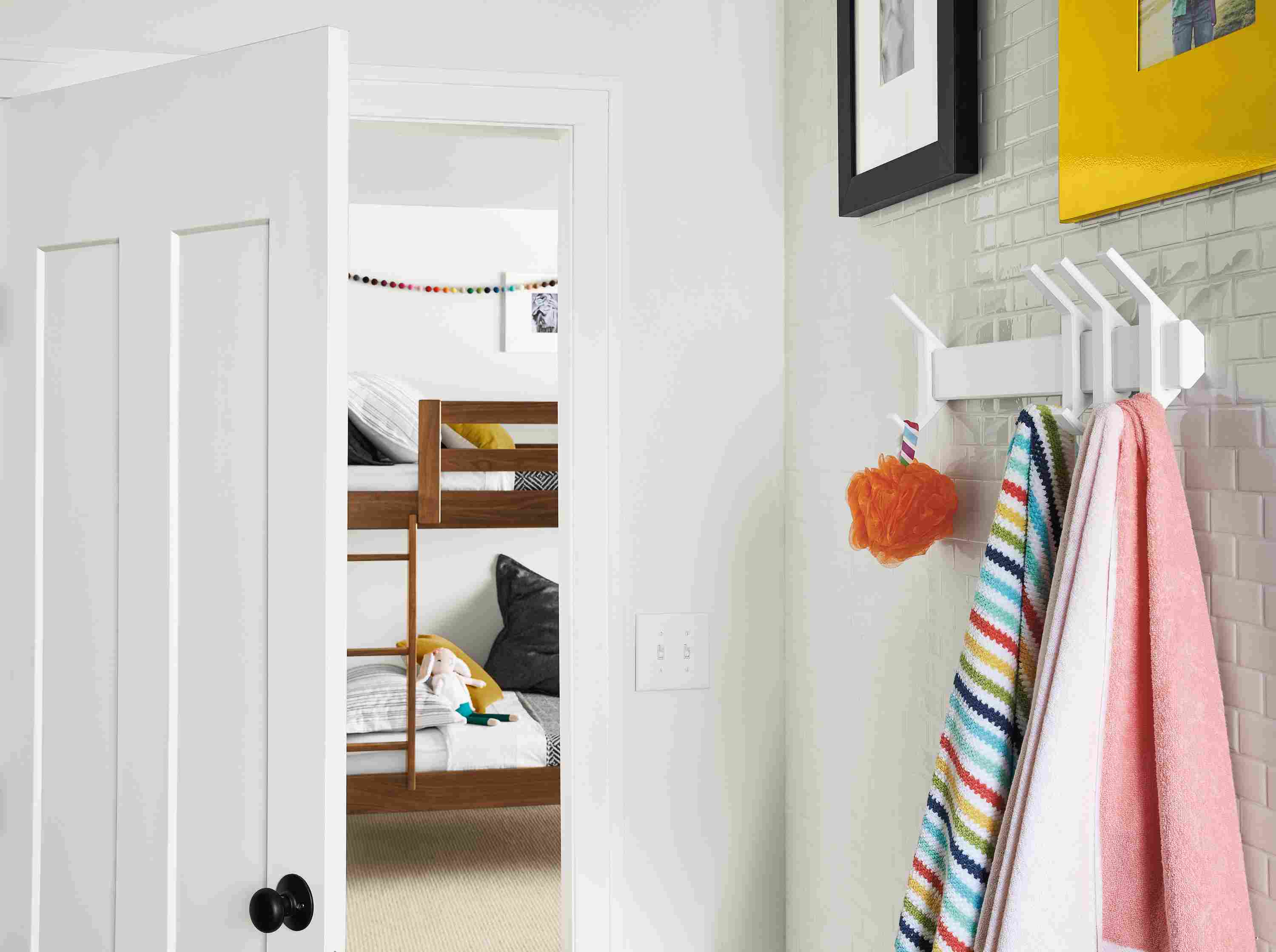 Detail of Orr multiple wall hooks in white with three hooks on right.