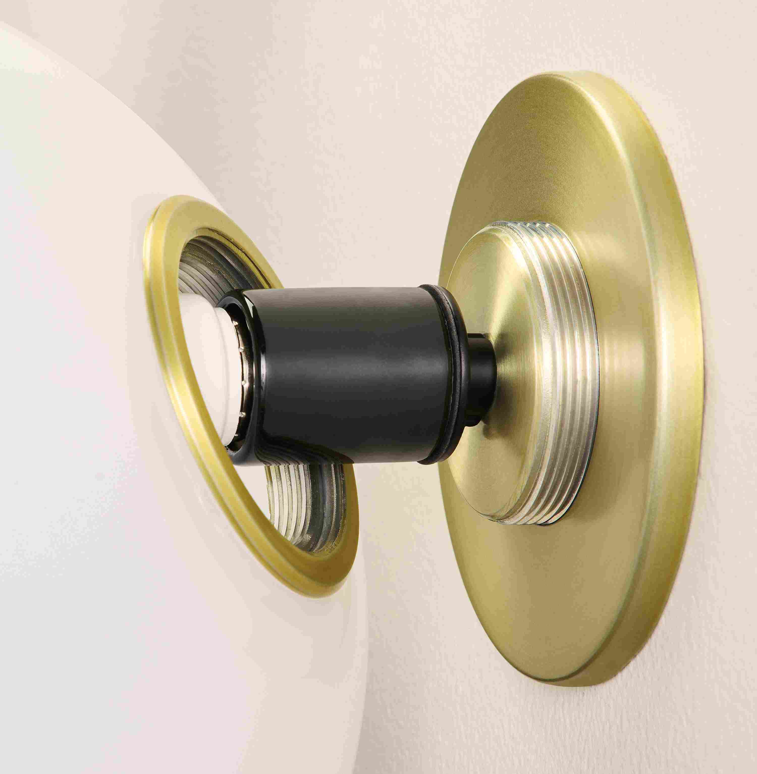 Osiris globe wall sconce in opal glass and brushed gold showing threaded mounting plate and mounting ring.