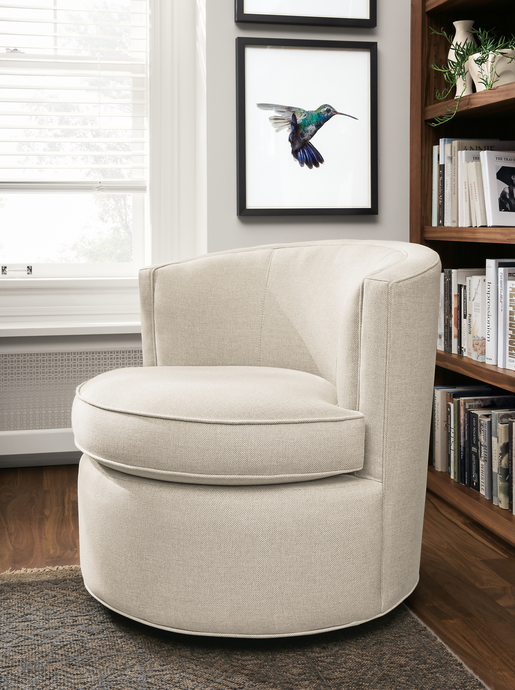 Detail of Otis swivel chair in Gino Oatmeal fabric.