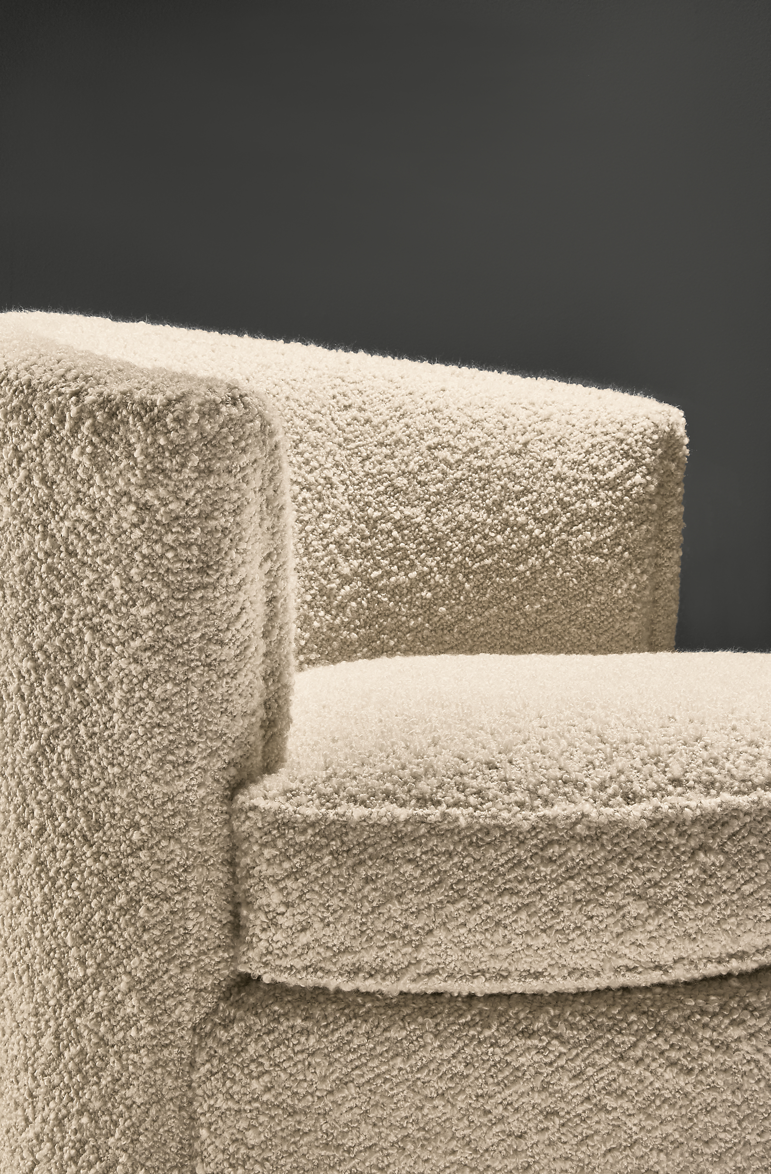 close-up of otis swivel chair in dornick ivory fabric.