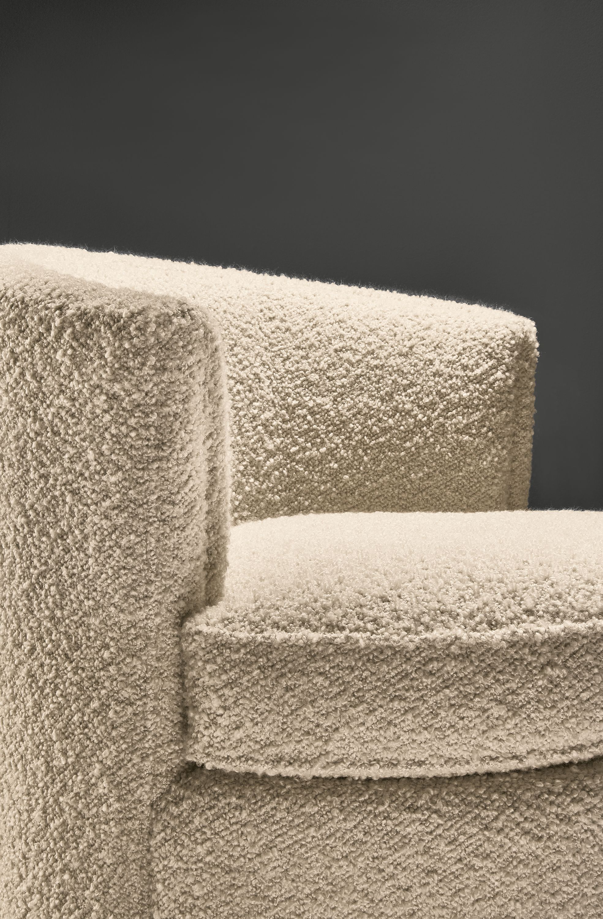 close-up of otis swivel chair in dornick ivory fabric.