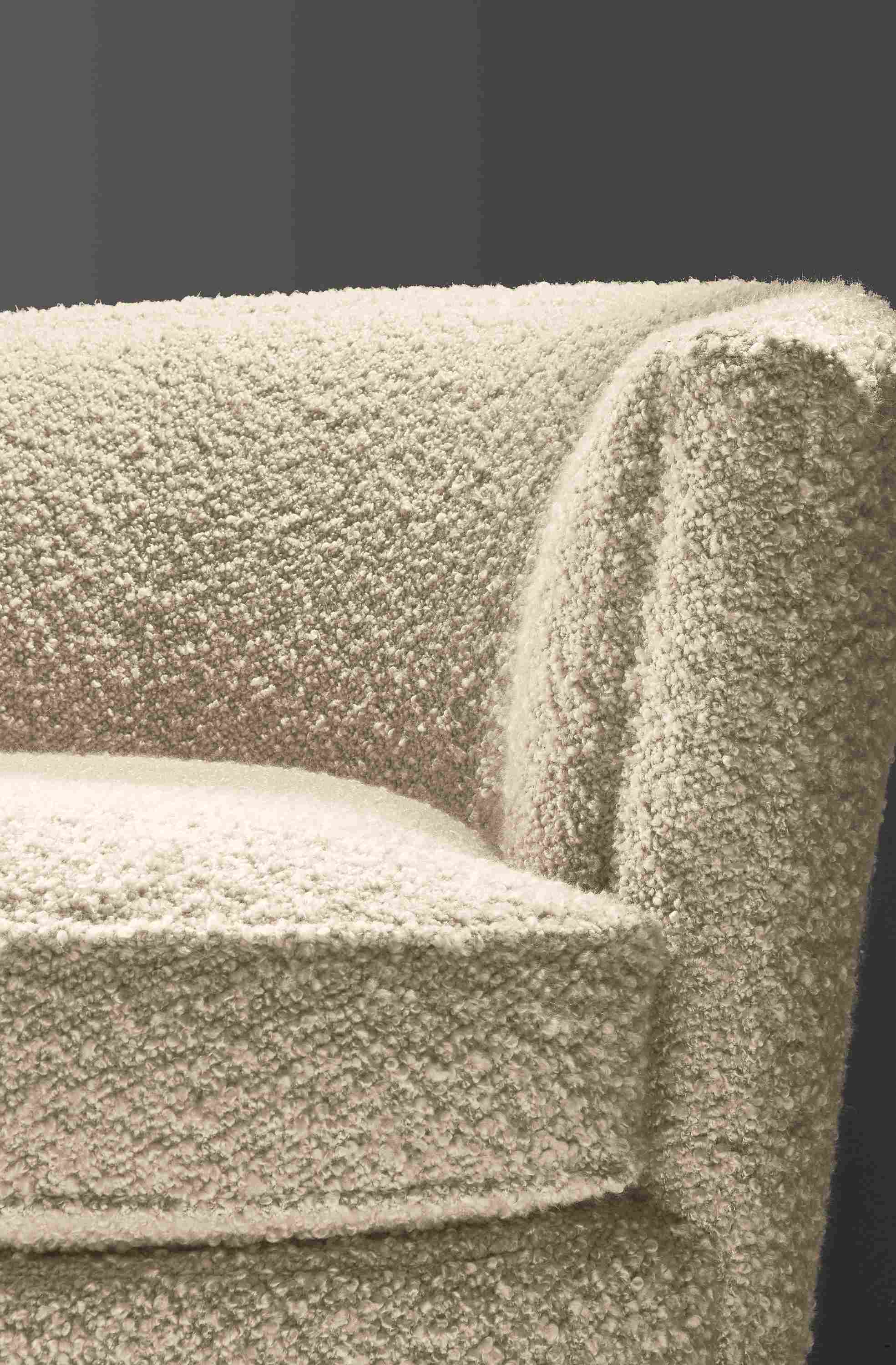 Close-up of Otis swivel chair in Dornick Ivory fabric.