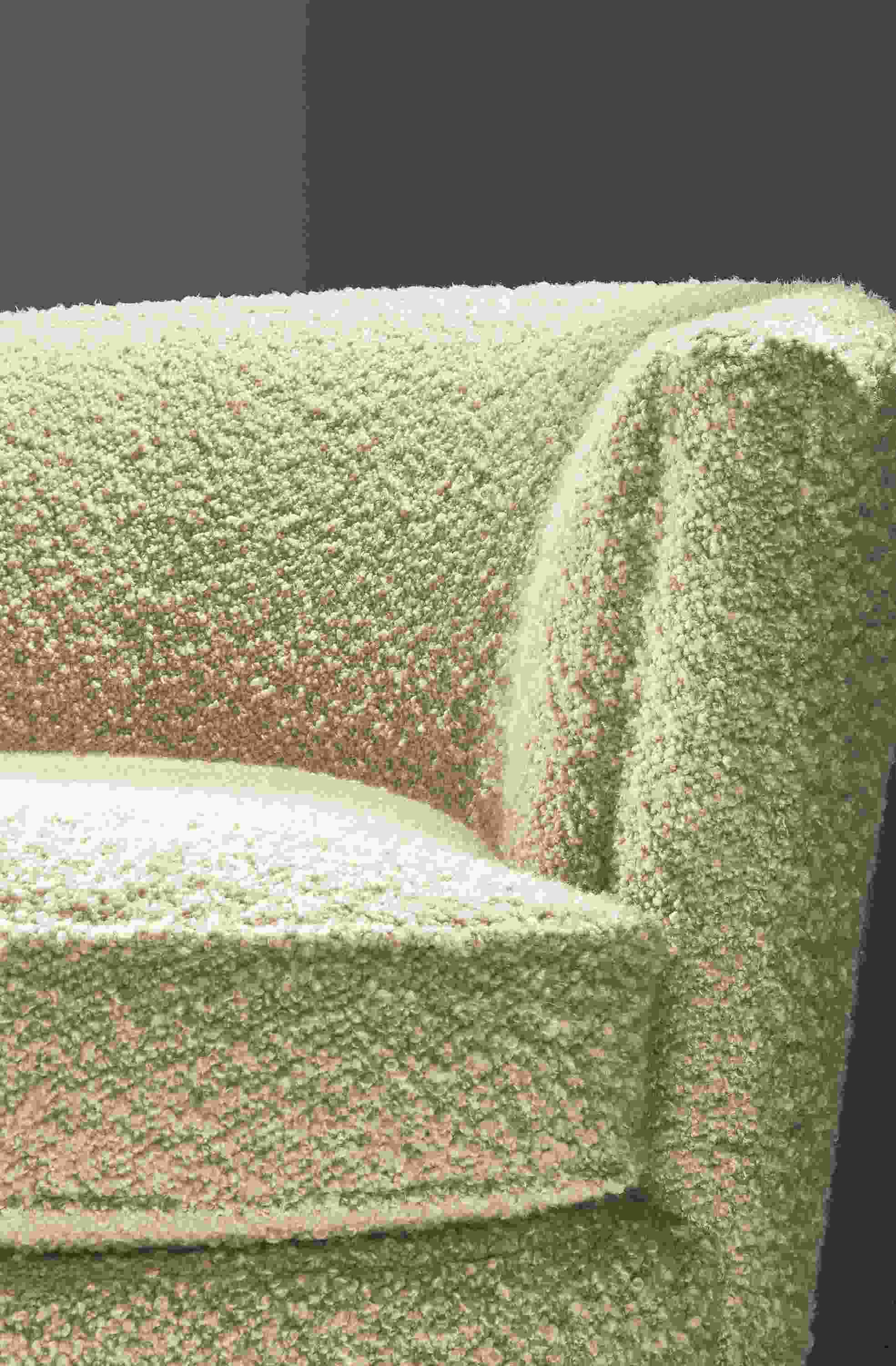 Close-up of Otis swivel chair in Dornick Ivory fabric.