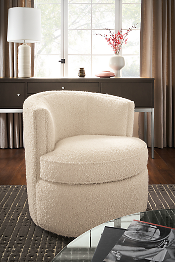 living room with otis swivel chair in dornick ivory fabric (exaggerated boucle).