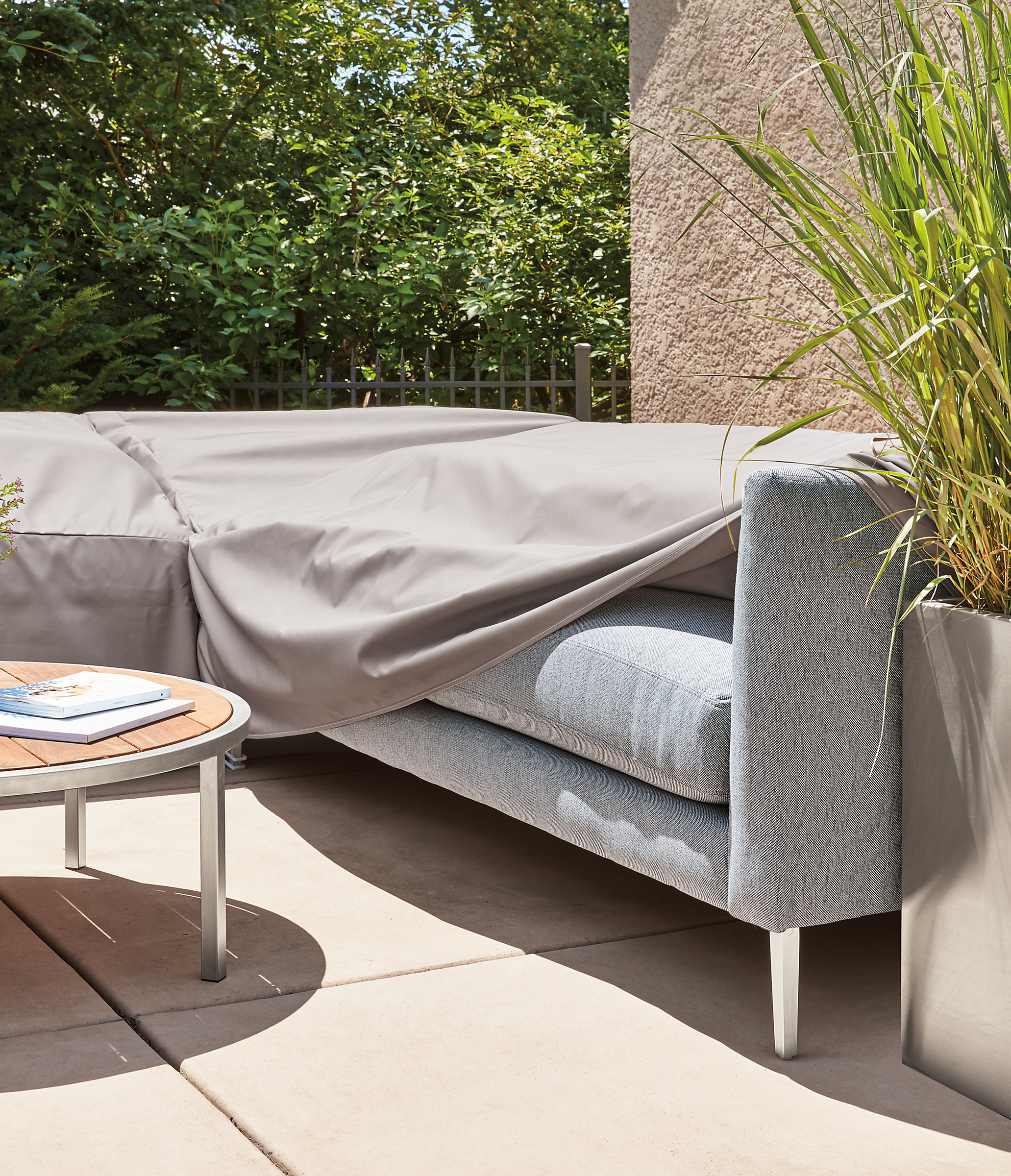 Outdoor patio setting with a Palm sectional and Outdoor Cover.