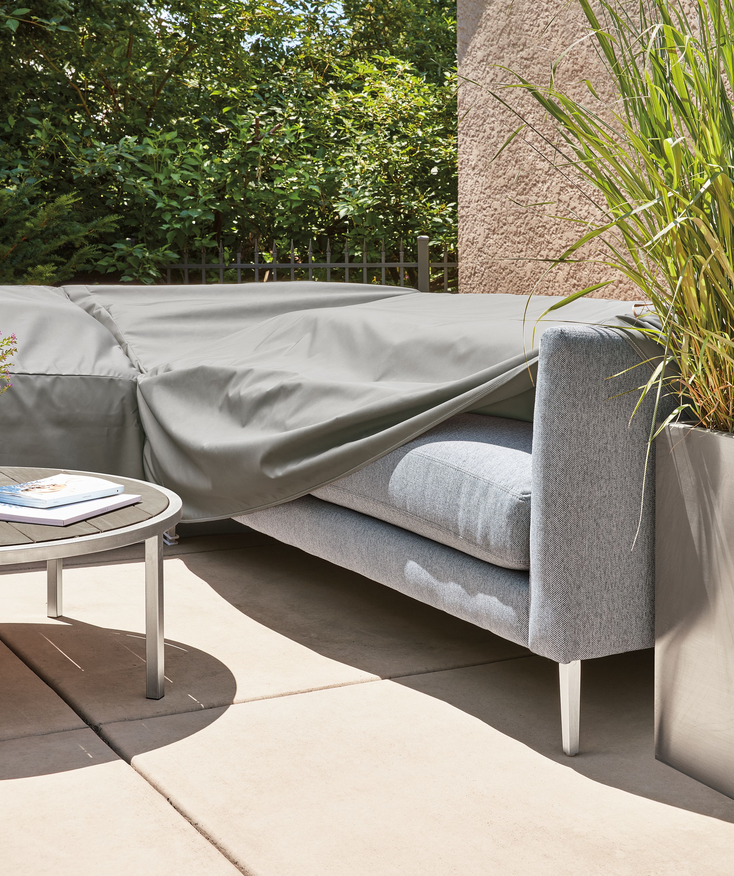 Detail of Outdoor Cover in WeatherMax Grey on Palm Three-Piece Sectional in Mist Navy fabric.