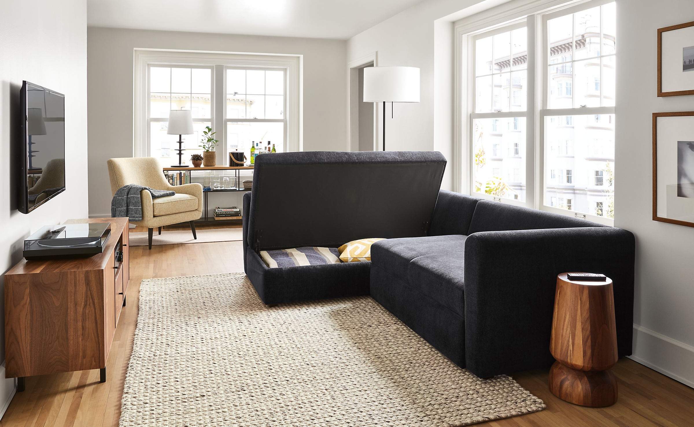 Living room setting with an Oxford Pop-Up Platform Sleeper and a Quinn Chair.