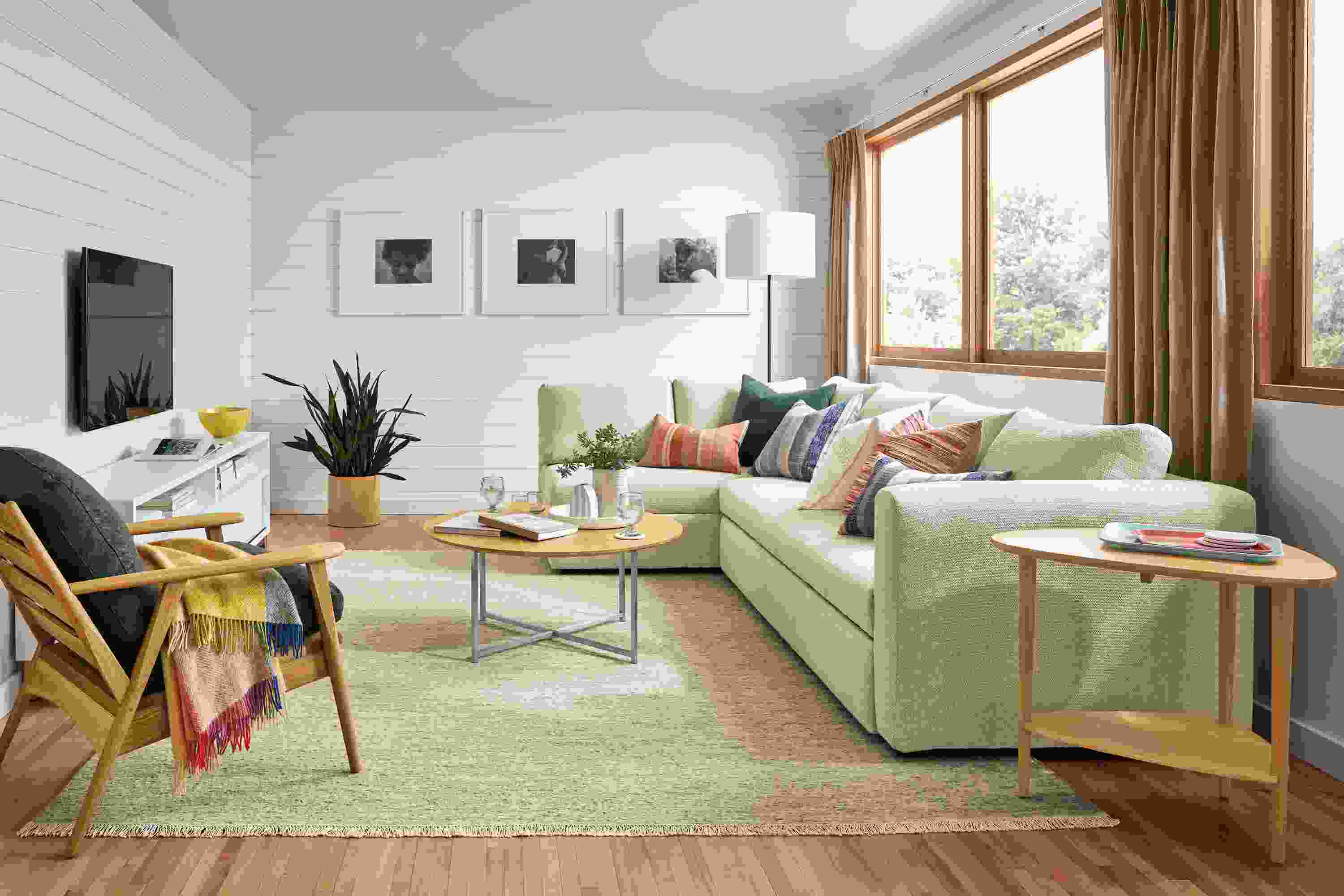 Living room with Oxford pop-up platform queen sleeper sofa in Orla Ivory and Gibson end table in white oak.