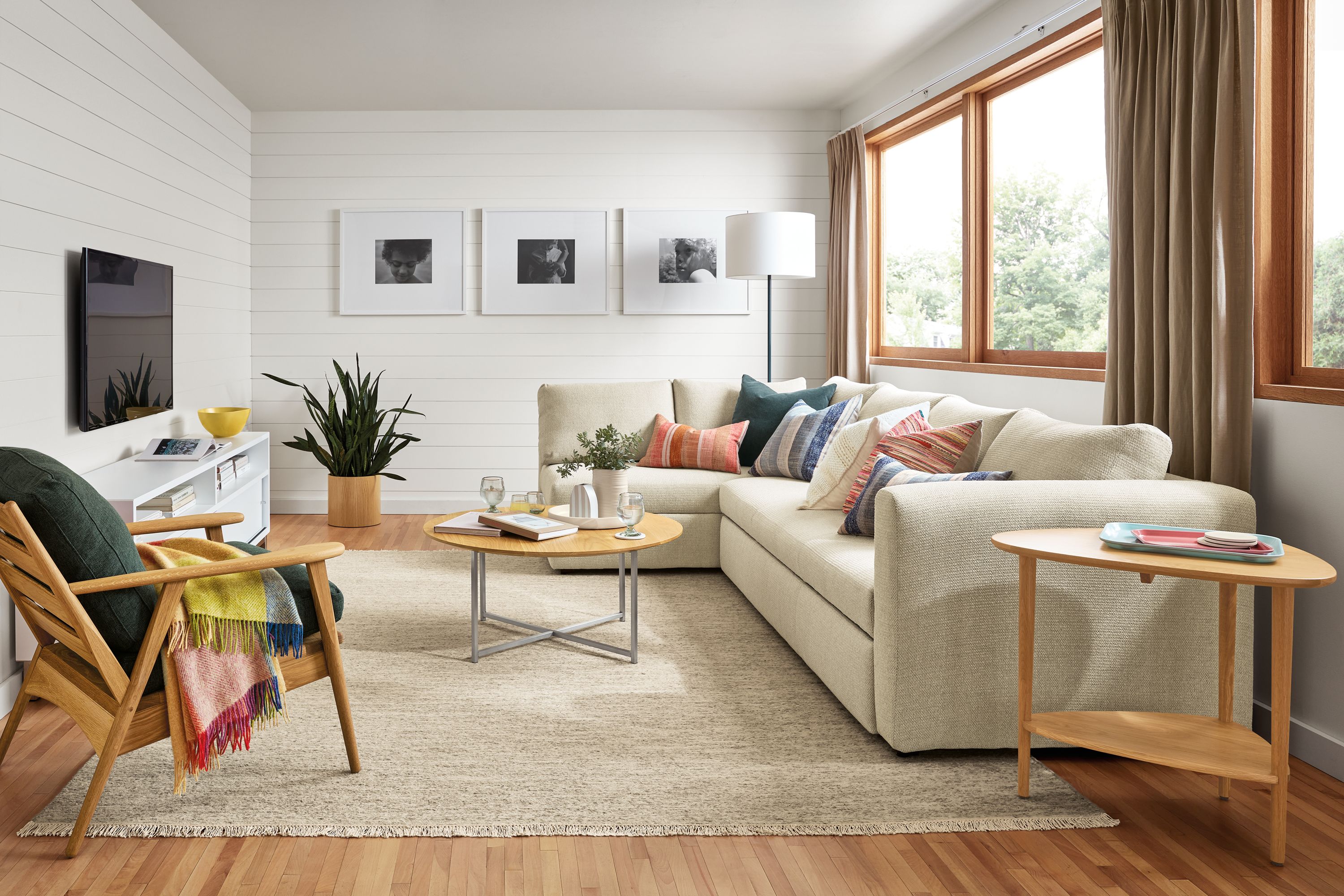 living room with oxoford sleeper sofa, dia rug, classic coffee table, ericson chair, gibson end table.