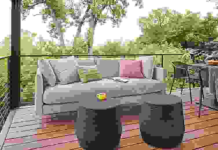 Detail of Palm outdoor sofa and Cusp round stools.