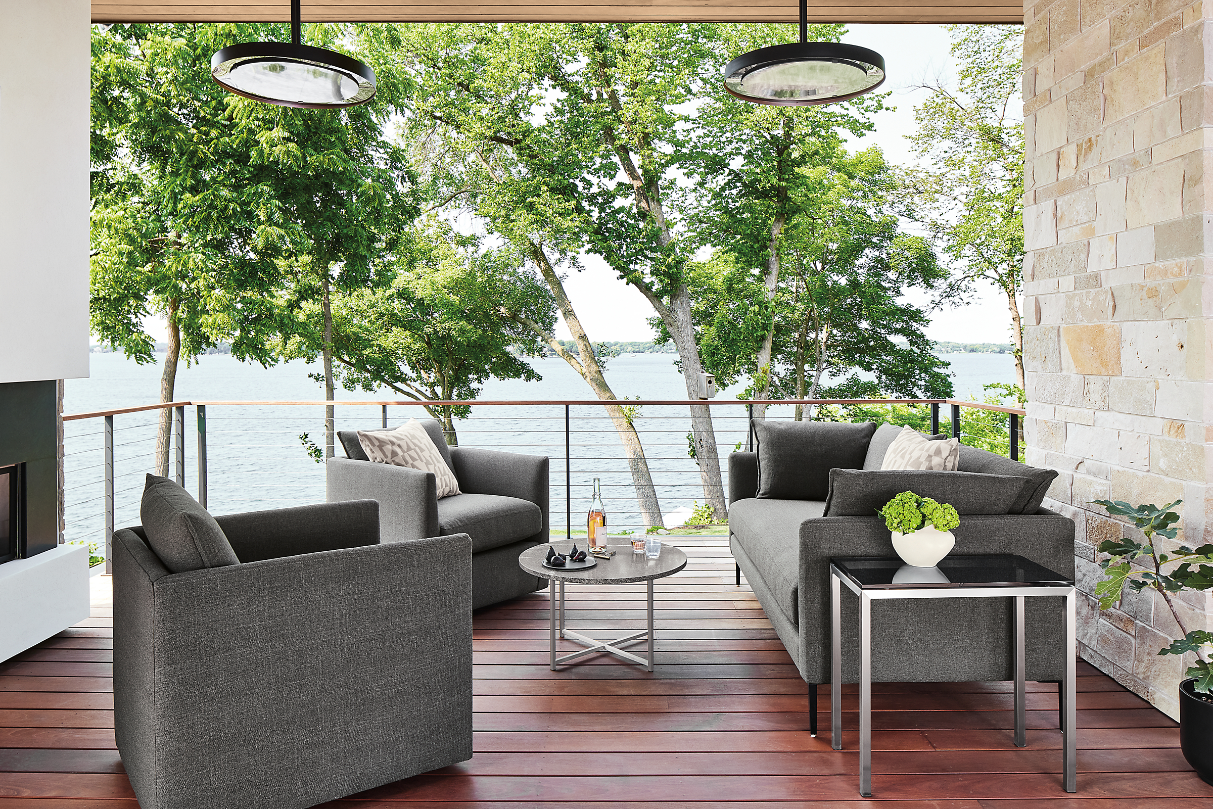 Outdoor space with palm sofa and palm swivel chairs in mist fabric.