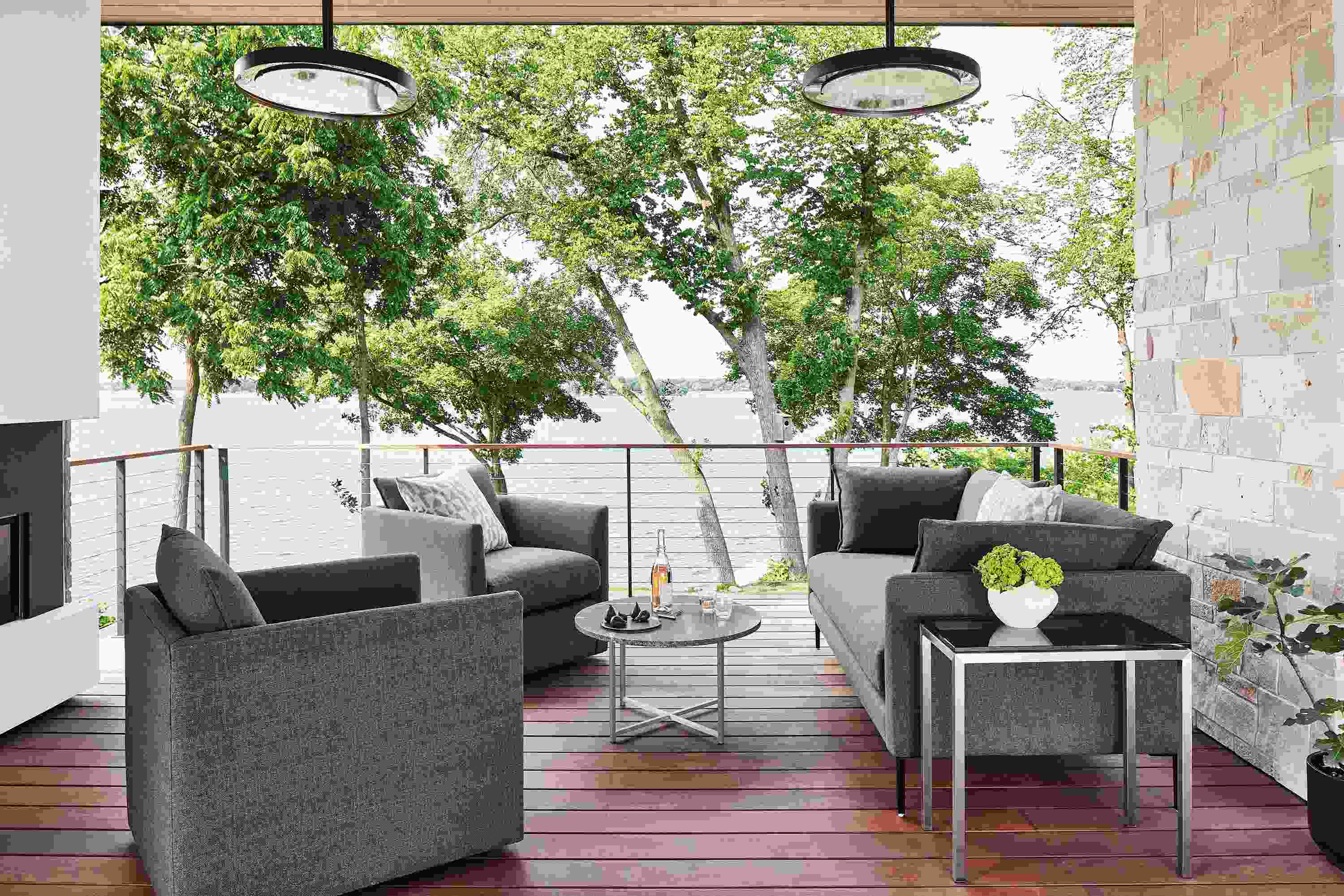 Outdoor space with palm sofa and palm swivel chairs in mist fabric.