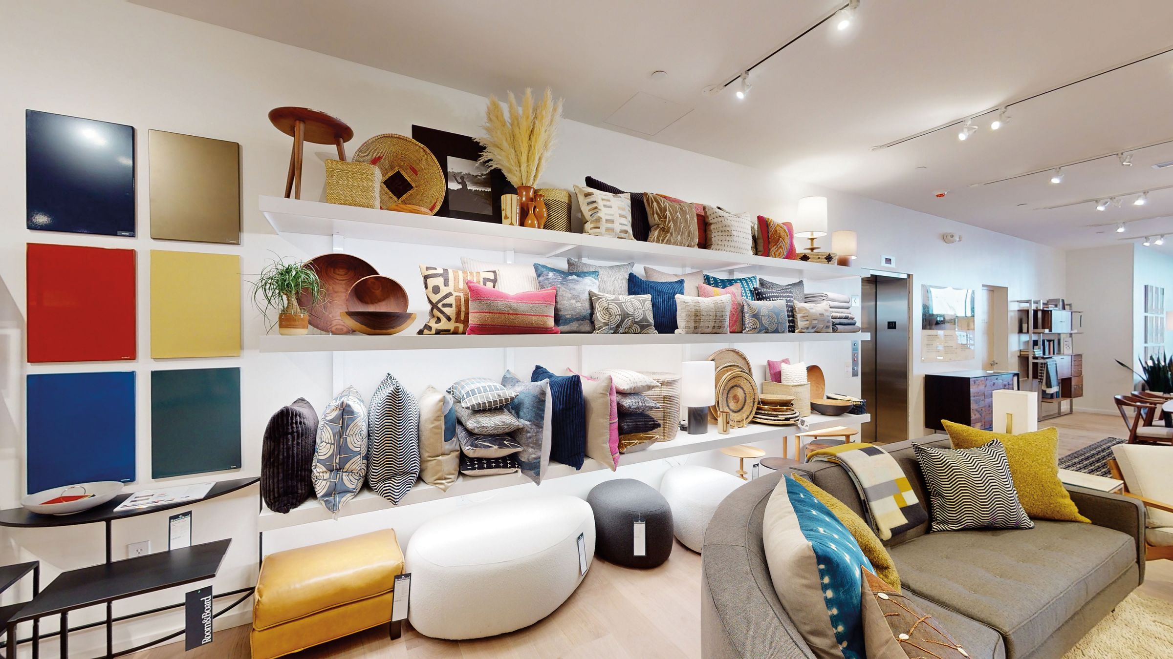 Room and Board store in Paramus, New Jersey showing a display of various pillows and decor.