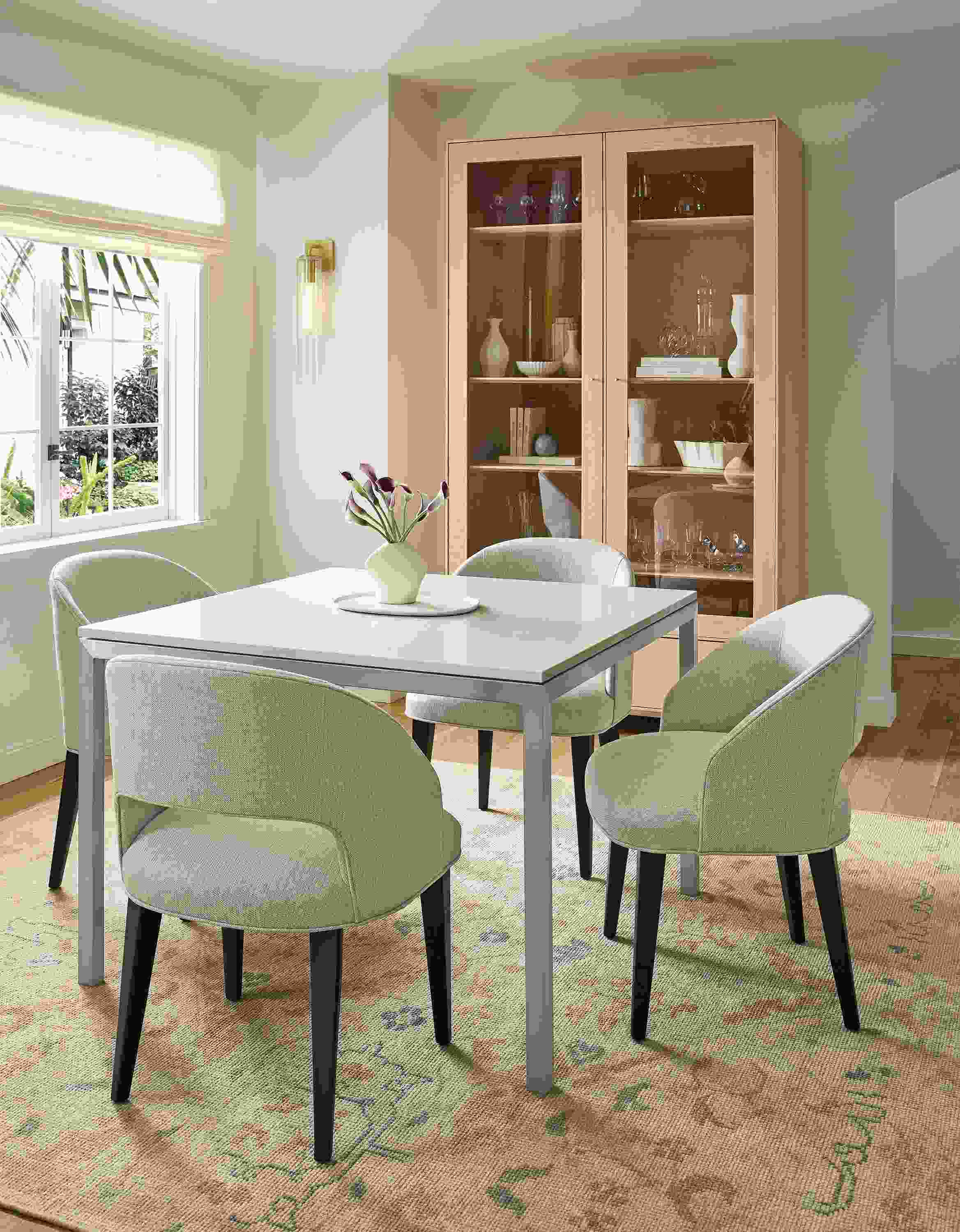 Dining room with Parsons 40-wide table in stainless with Light Grey Quartz top and 4 Esme chairs in Sumner Linen.
