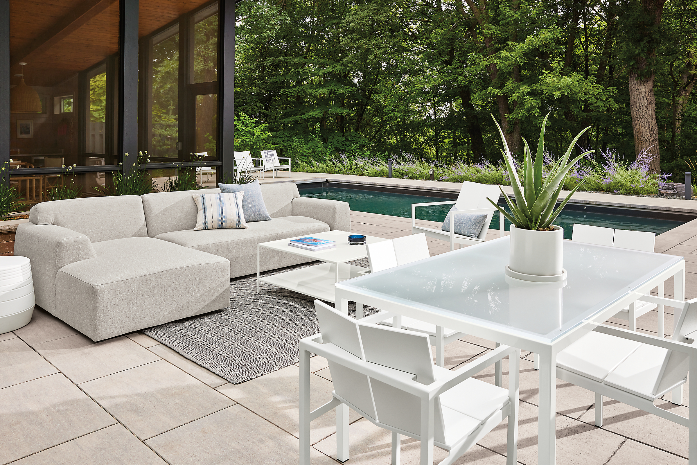 Outdoor space with parsons outdoor table, mattix dining chairs, drift sofa.