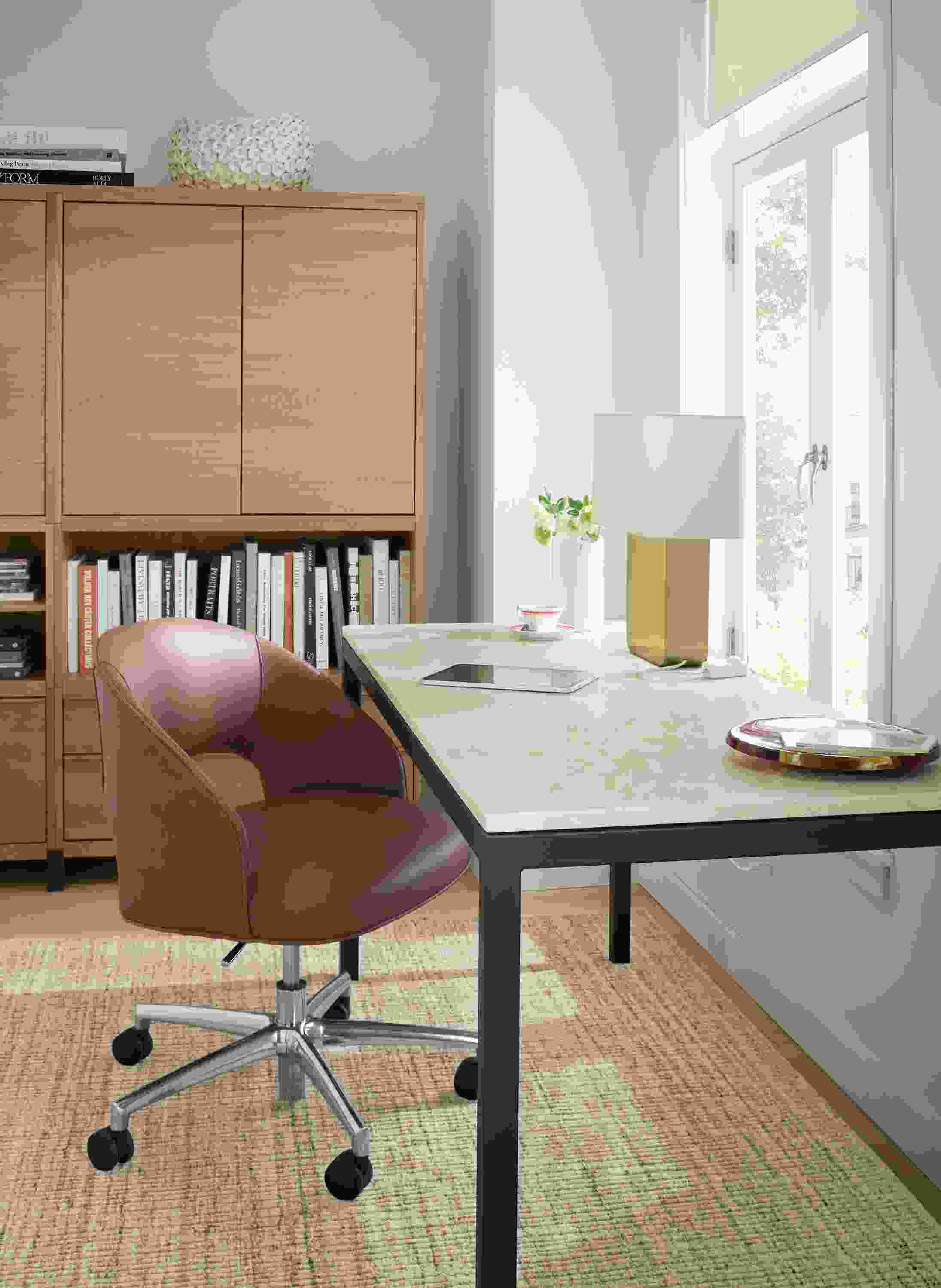 Home office with Parsons table in natural steel and Mahal Quartz and Esme office chair in Laino Cognac leather.