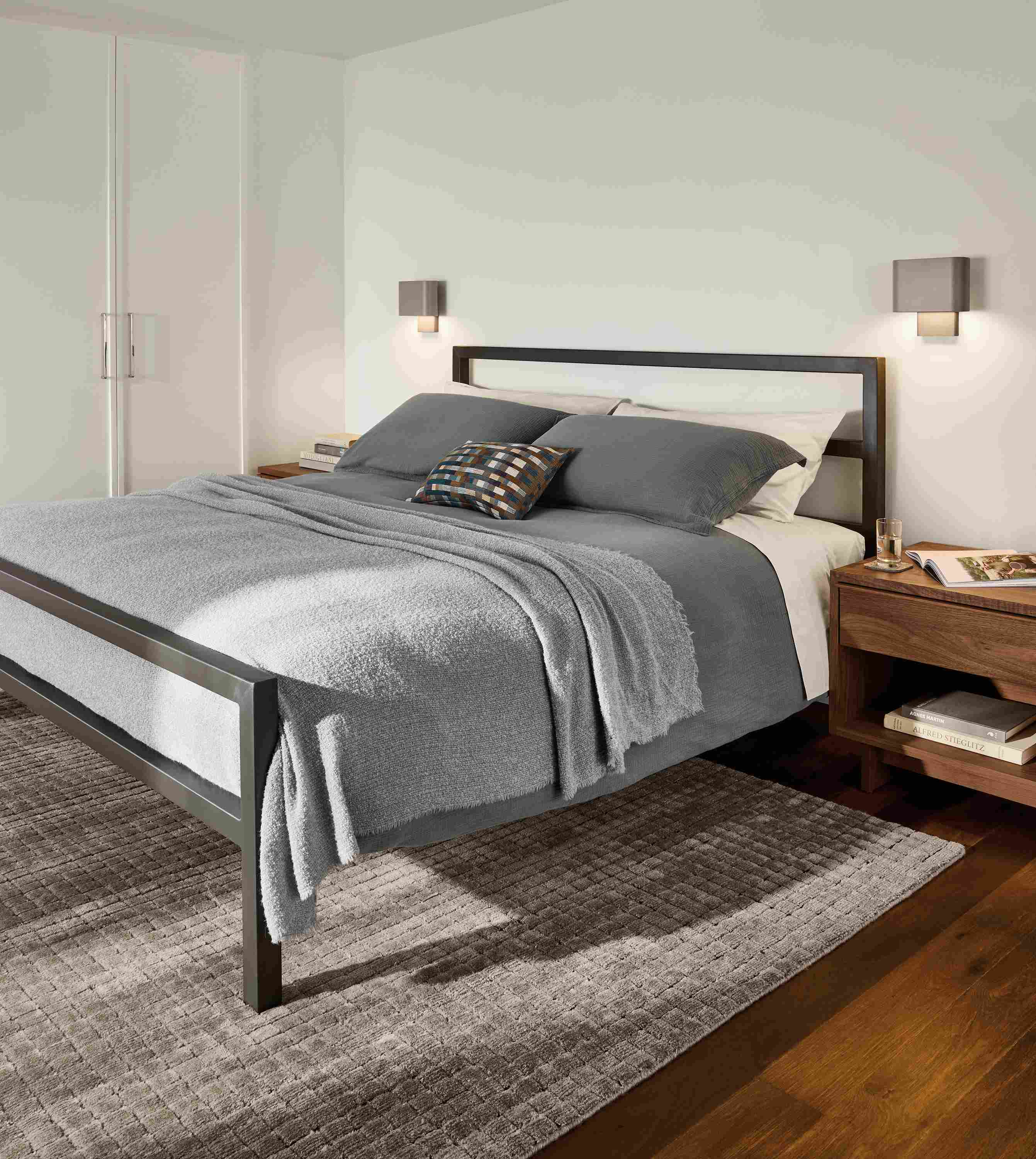 Bedroom with Parsons king bed in natural steel, Safira rug in putty and Strand king duvet set in dusk.