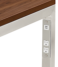 Detail of Parsons table in stainless steel and power cord outlets.