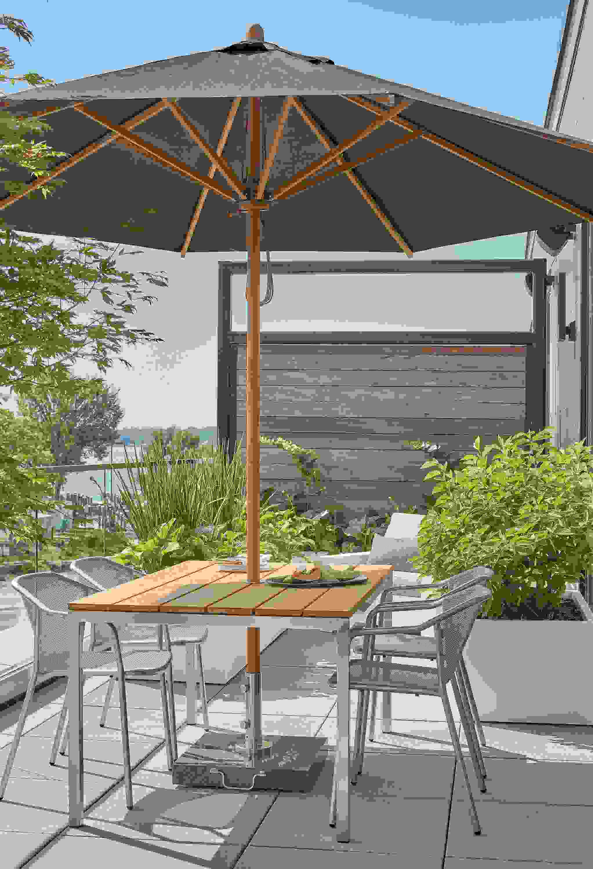 Parsons 60-wide outdoor table, Theo chairs and Cirro patio umbrella.