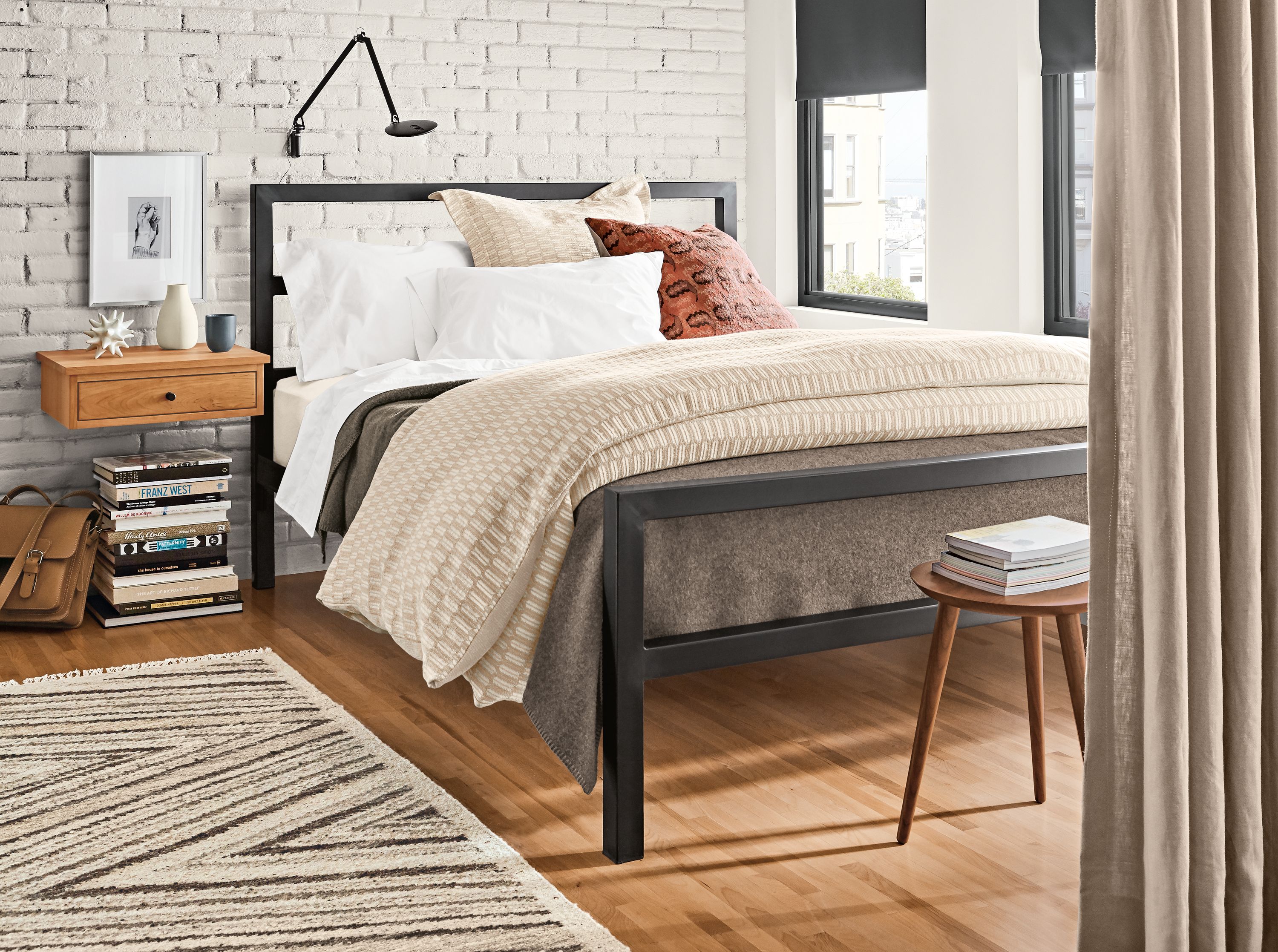 Detail of Parsons steel bed in modern bedroom.