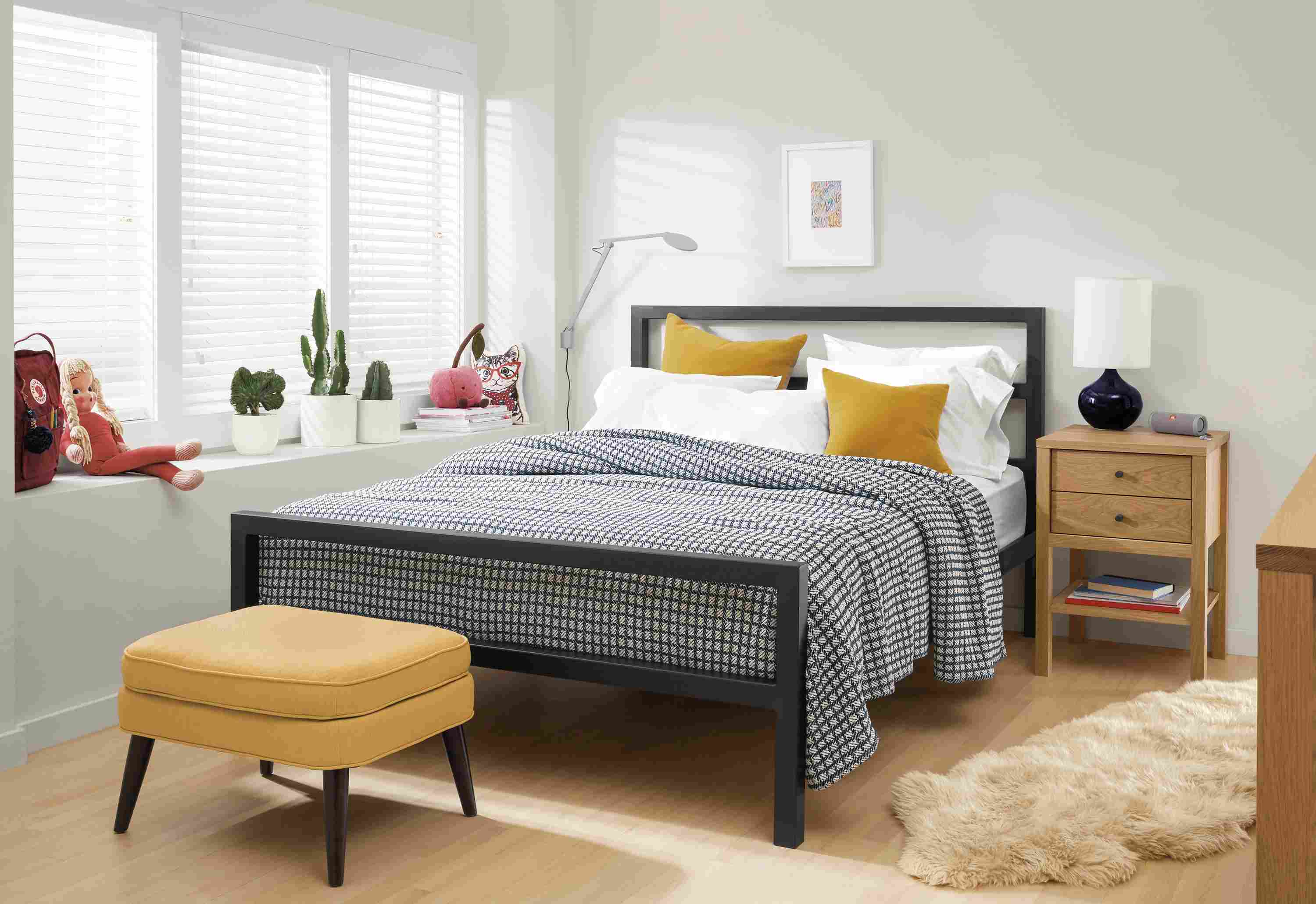 Detail of Parsons steel bed in small room.