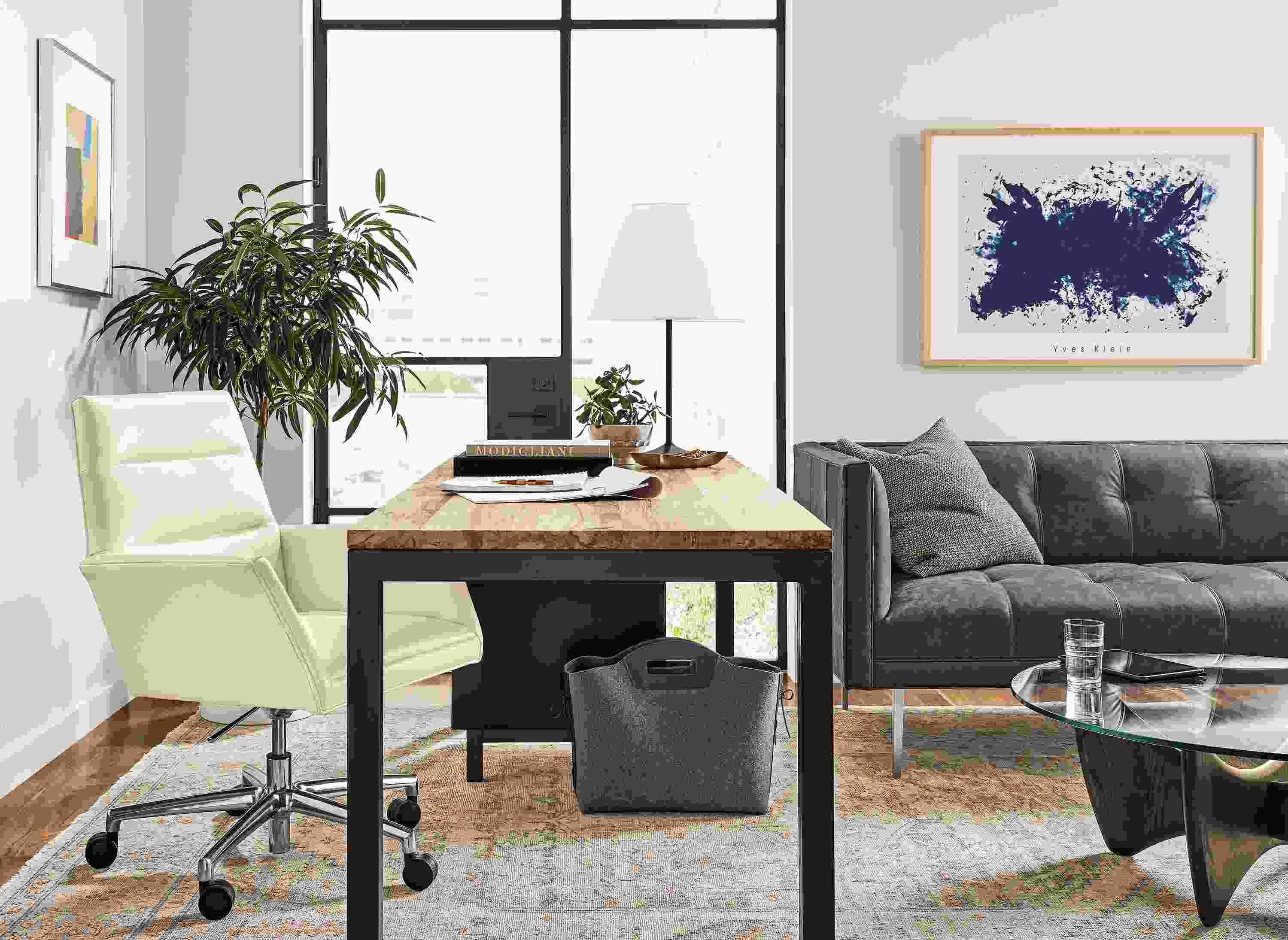 Detail of Parsons desk in modern executive office.