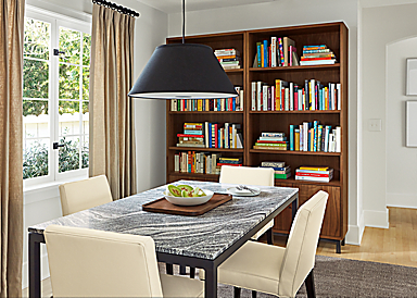 Dining room with Parsons table, Ava chairs, Luisa pendant, Copenhagen bookcases.