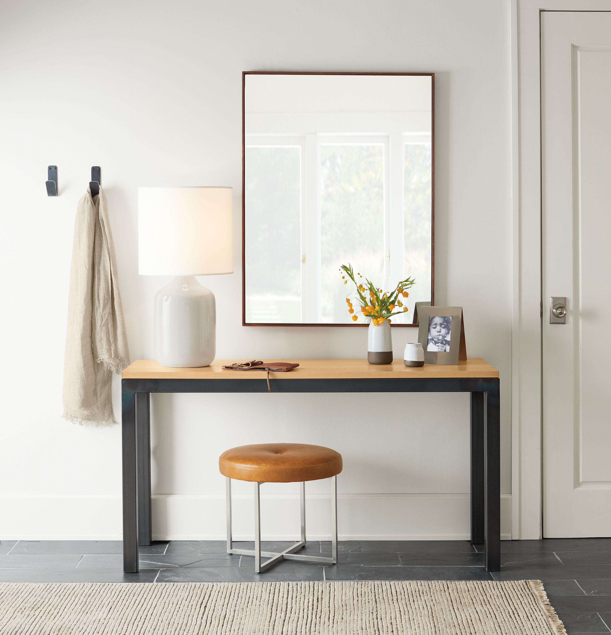 Parsons console table in small entryway.