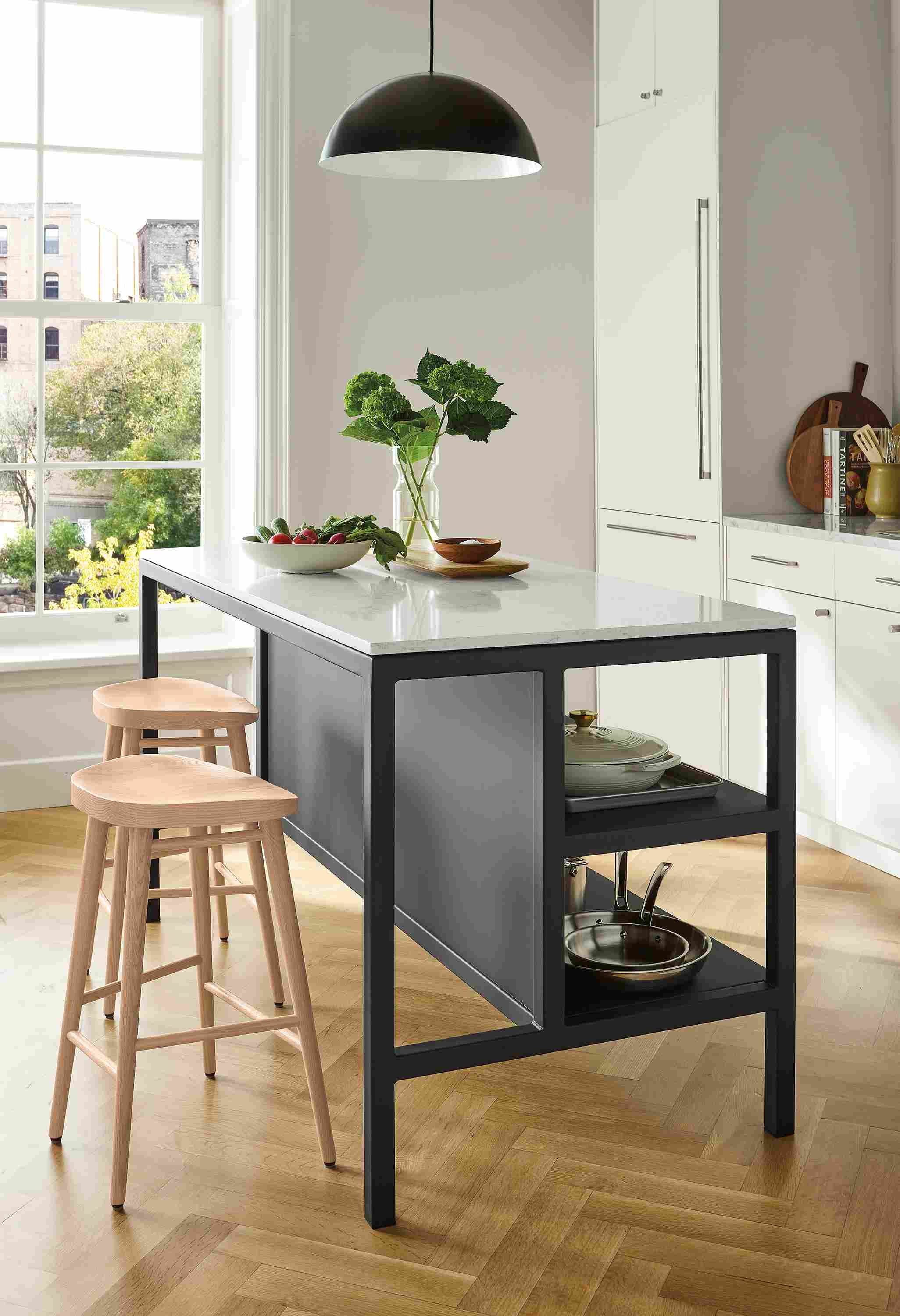 Kitchen with Parsons narrow shelf counter table in graphite with marbled white quartz top and 2 Bay counter stools in salt on red oak.