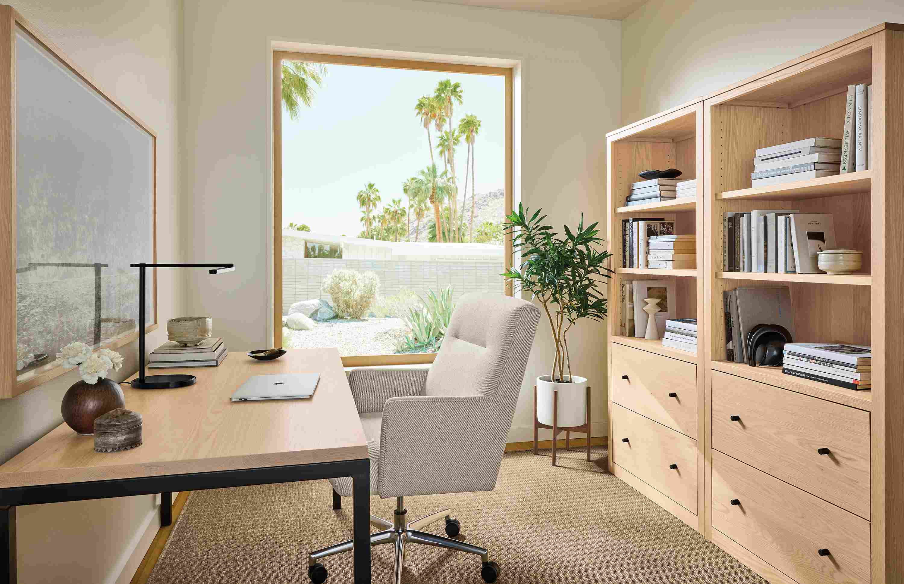 Home office with parsons table in salt on red oak and natural steel and 2 woodwind bookcases in salt on red oak.