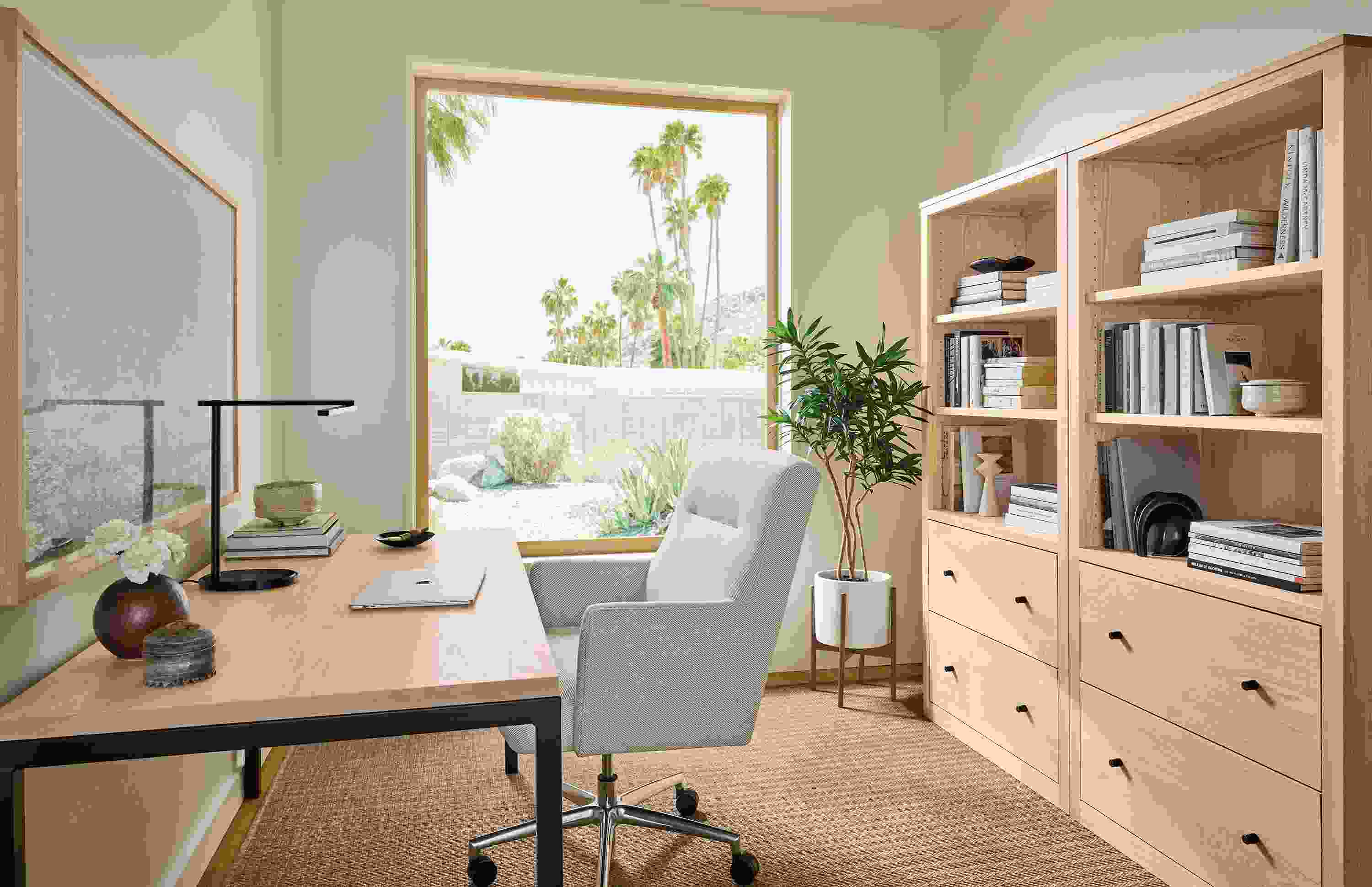 Home office with parsons table in salt on red oak and natural steel and 2 woodwind bookcases in salt on red oak.