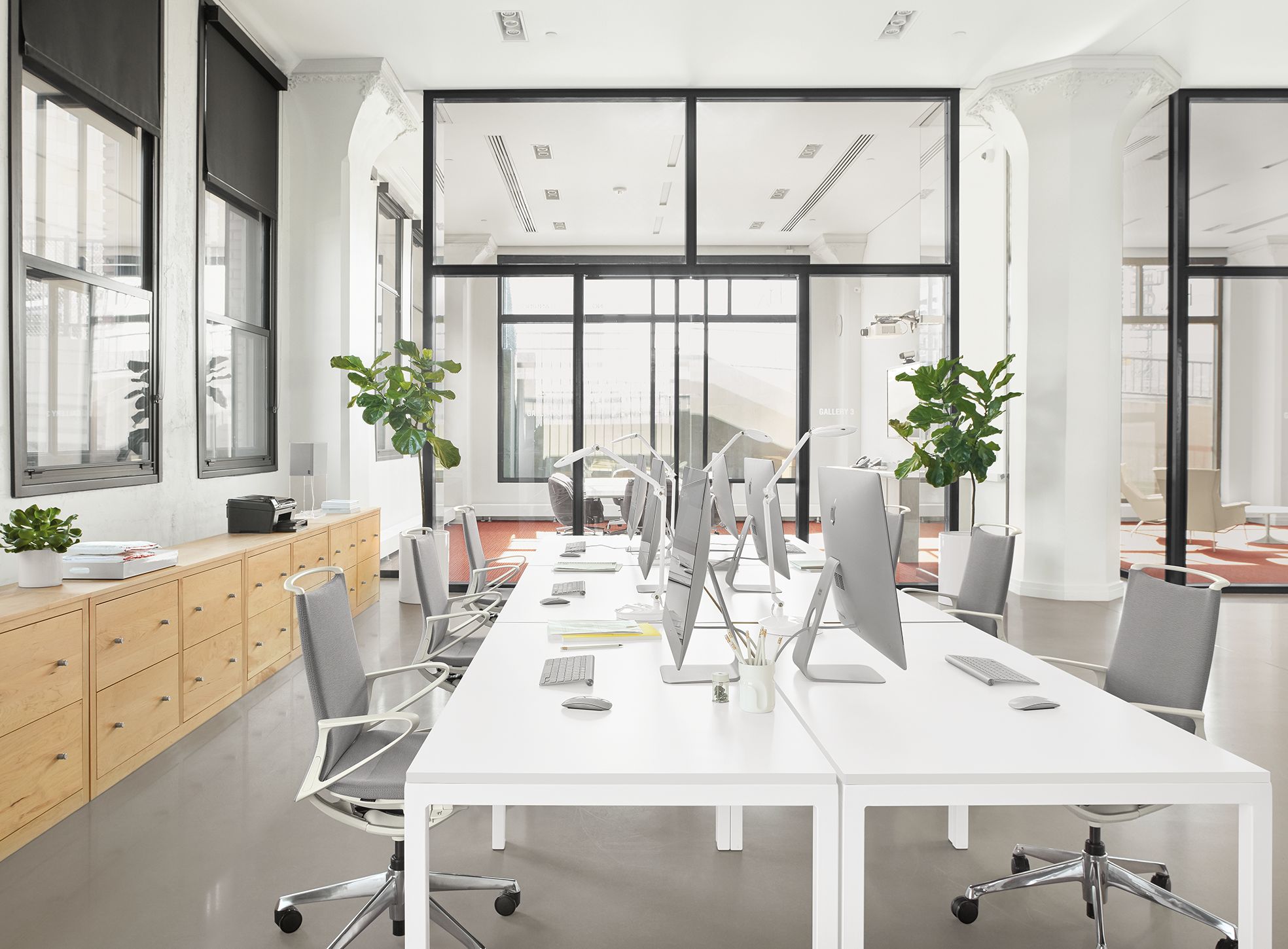 Business Interiors setting with Parsons 60-wide table with legs and plimode office chairs.