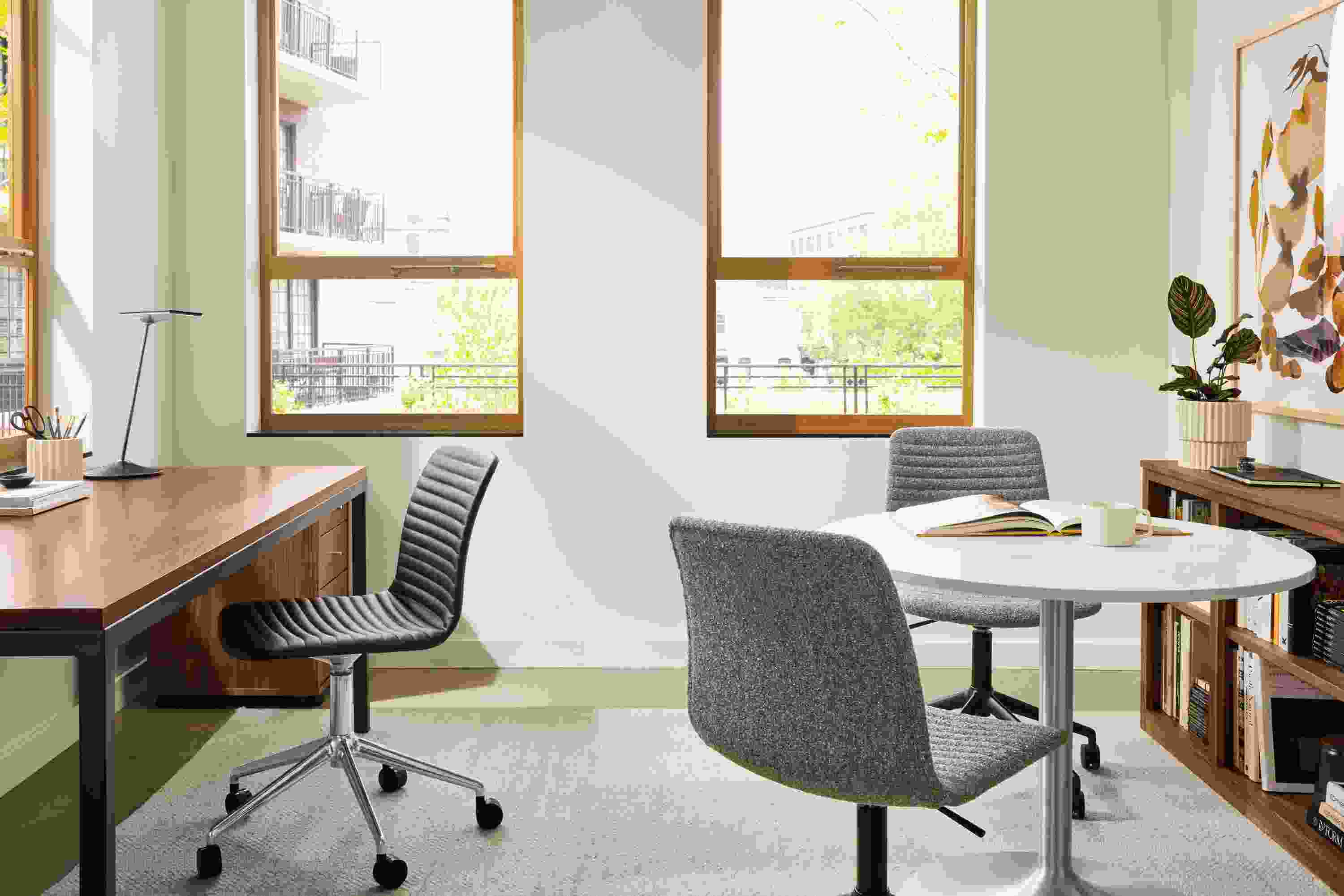 Office space with Parsons table in natural steel and walnut, and 2 Cato office chairs in Zavin Stone.