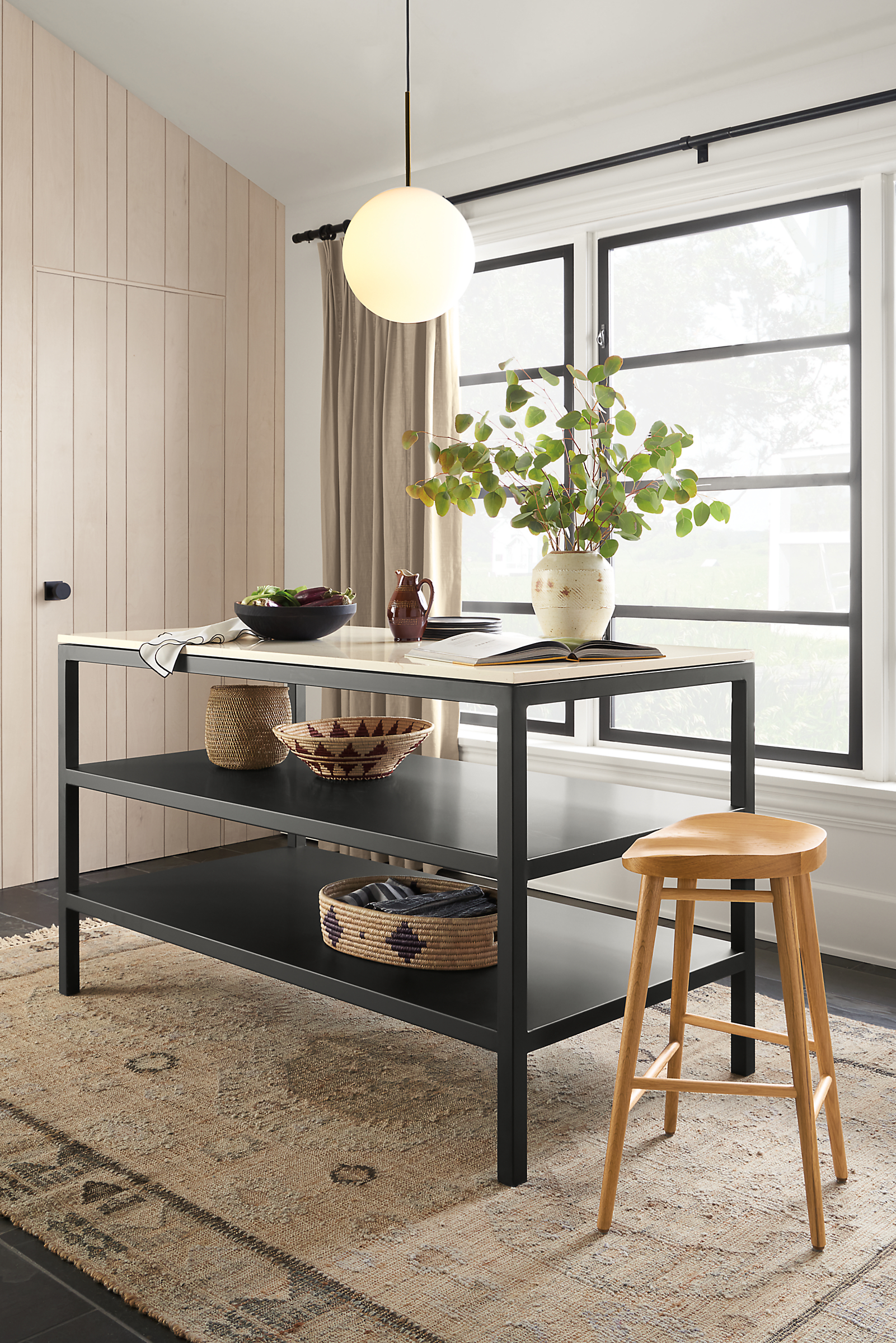 Room setting with Parsons 60-wide by 30-deep Two-shelf counter table and bay counter stool.