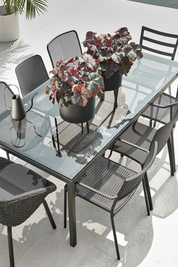 Outdoor setting with parsons 72-wide table with outdoor dining chairs.