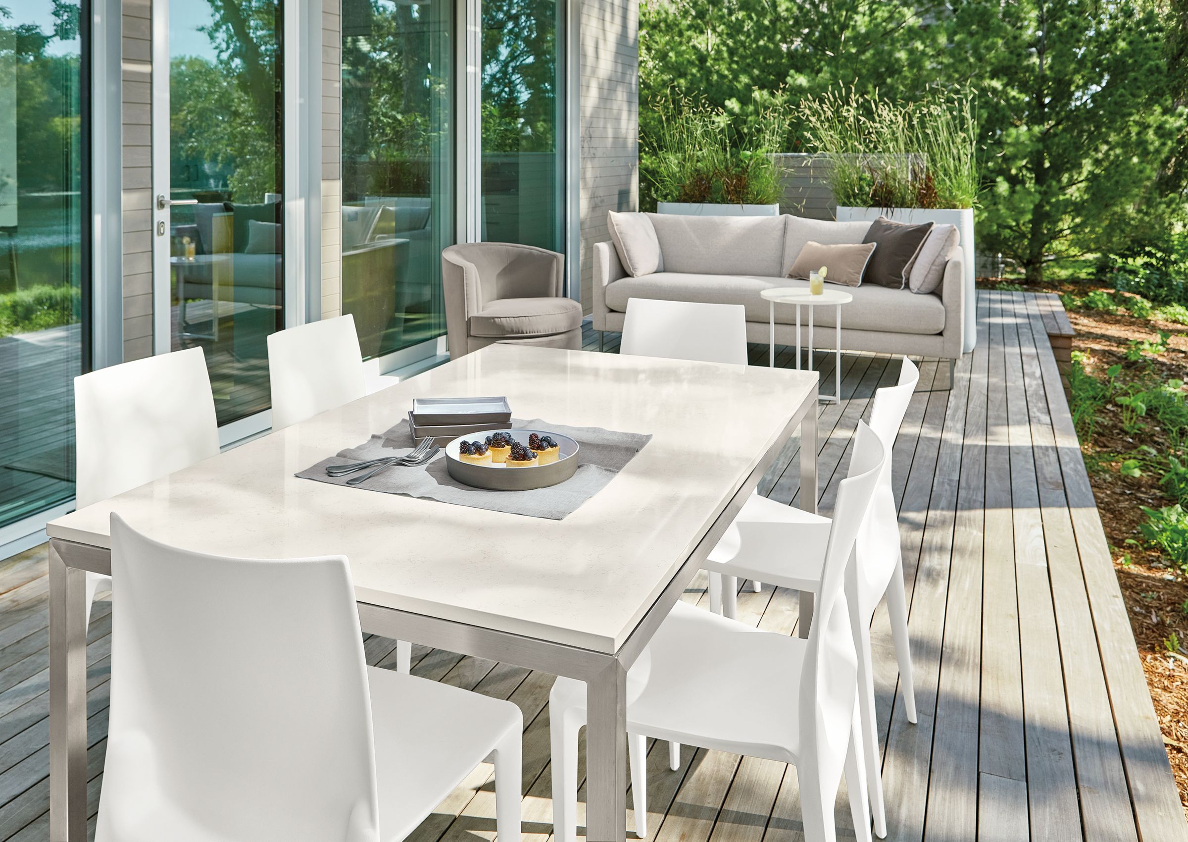 Outdoor space with Parsons table, Bellini chairs, Palm sofa, Ambrose swivel chair.