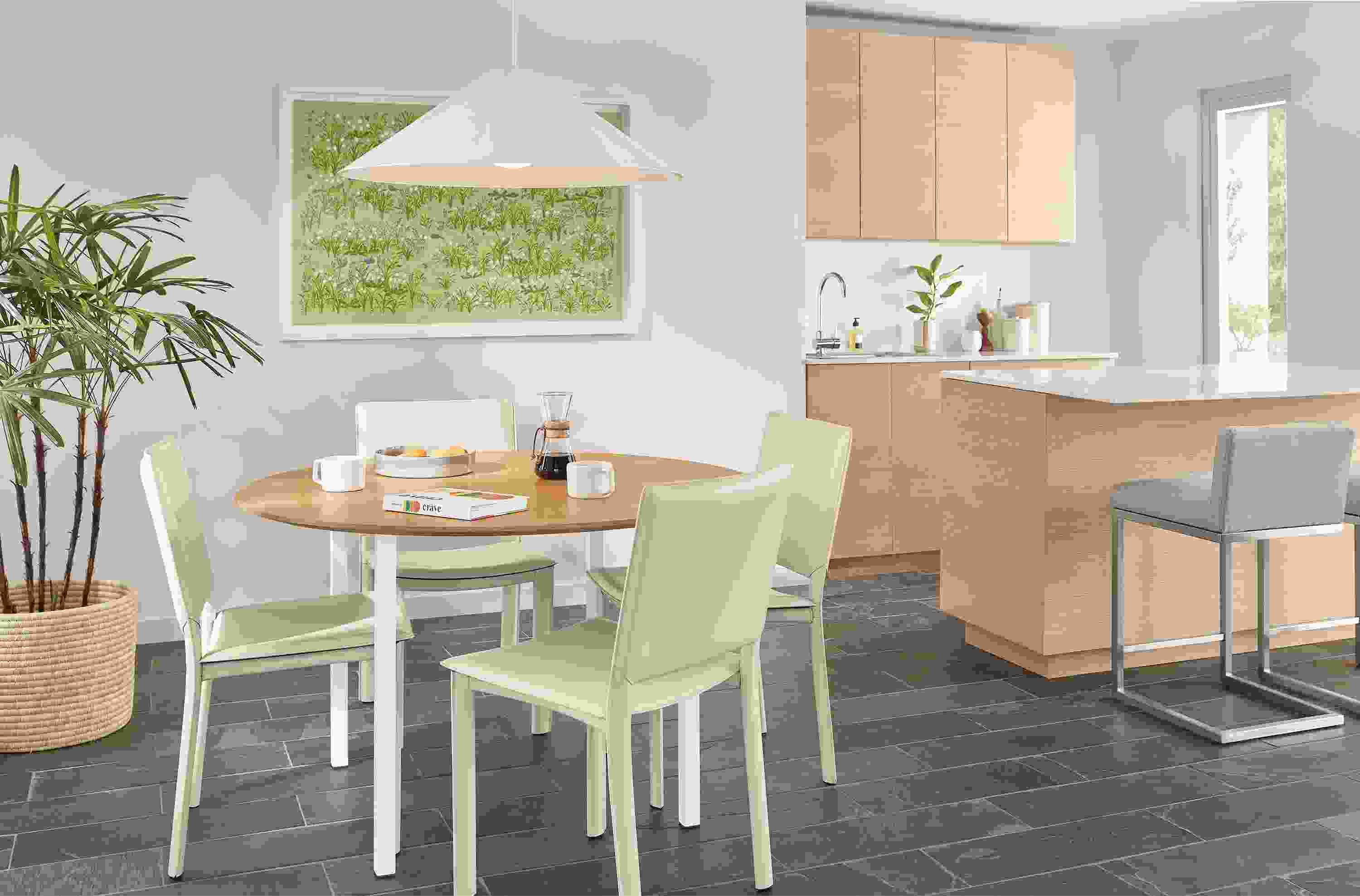 Dining setting with 48-diameter Parsons leg table with madrid chairs in ivory.