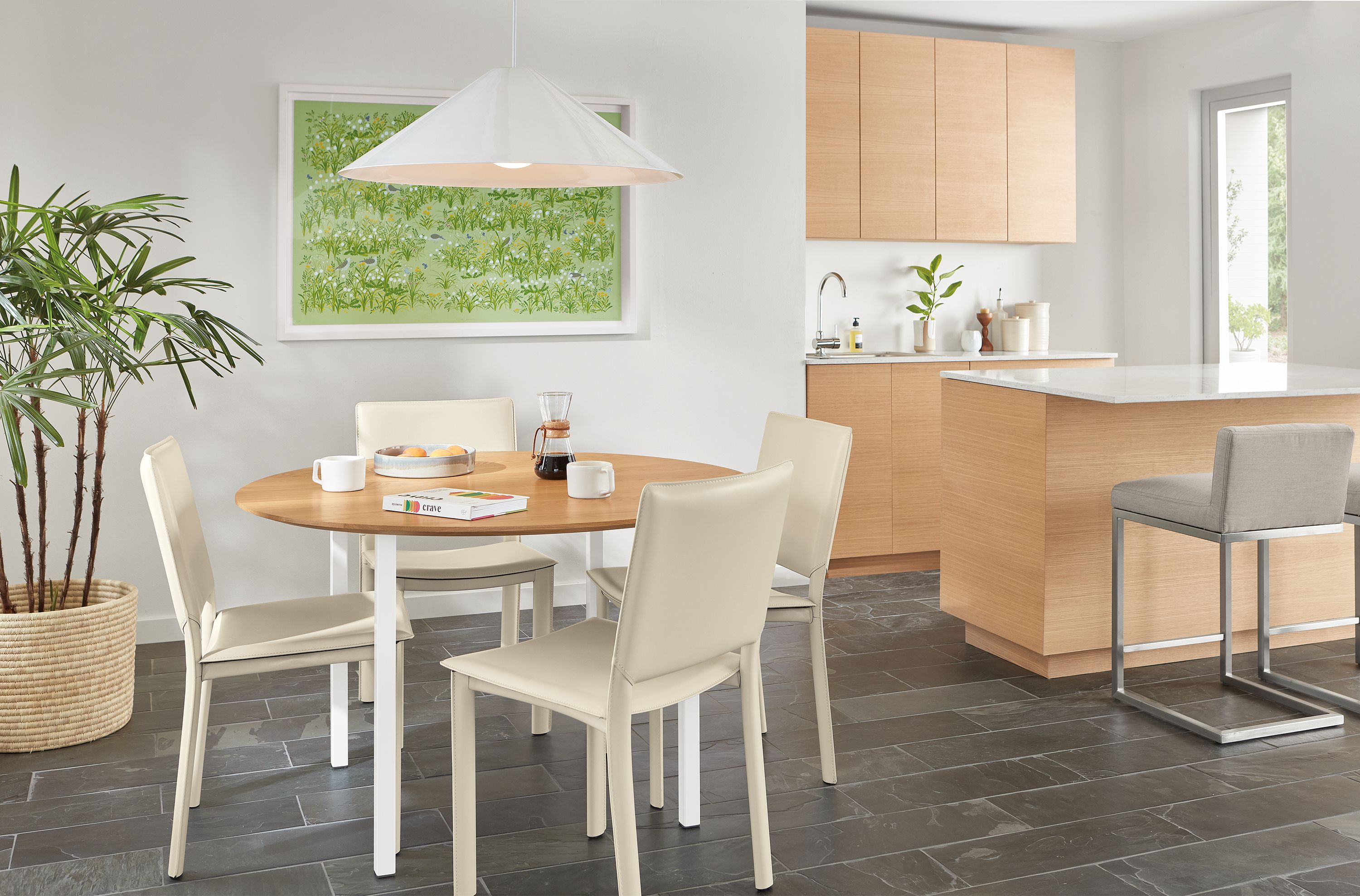 Dining setting with 48-diameter Parsons leg table with madrid chairs in ivory.