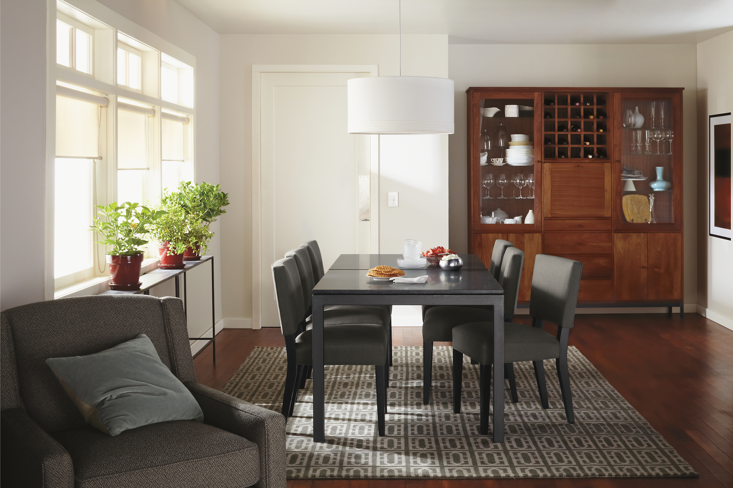 Dining setting with parsons 72-wide by 36-deep dining room table with mesabi black granite top and georgia chairs with linear storage cabinet.