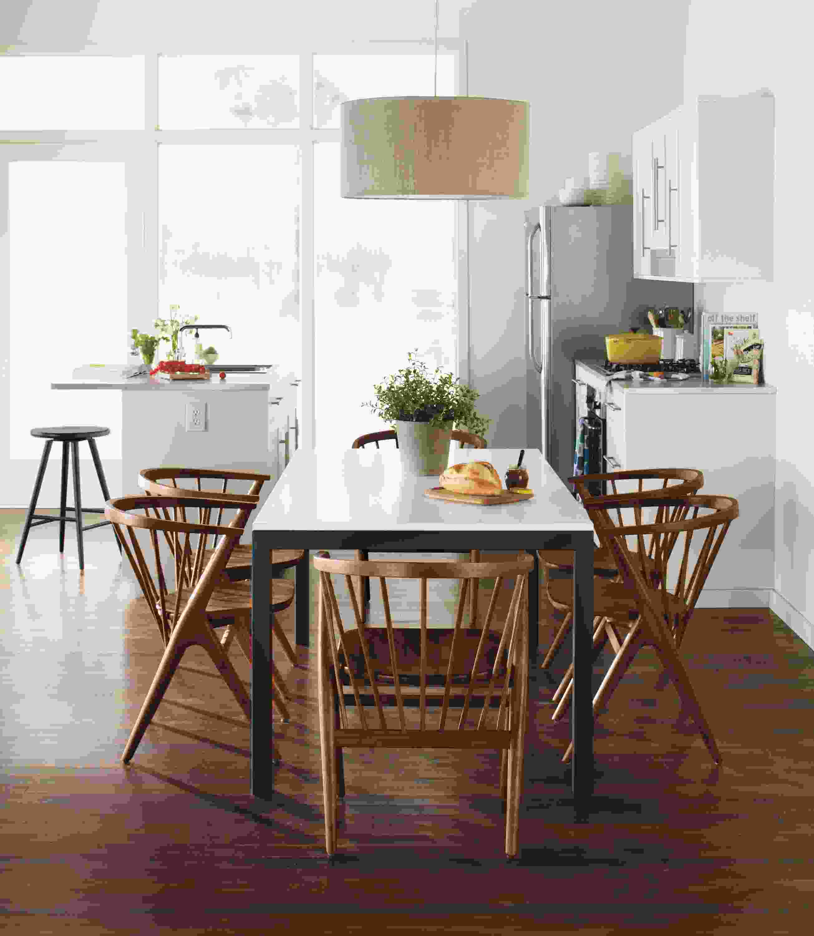 Dining setting with parsons 72-wide by 36-deep dining room table with white MDF top and Soren dining chairs.