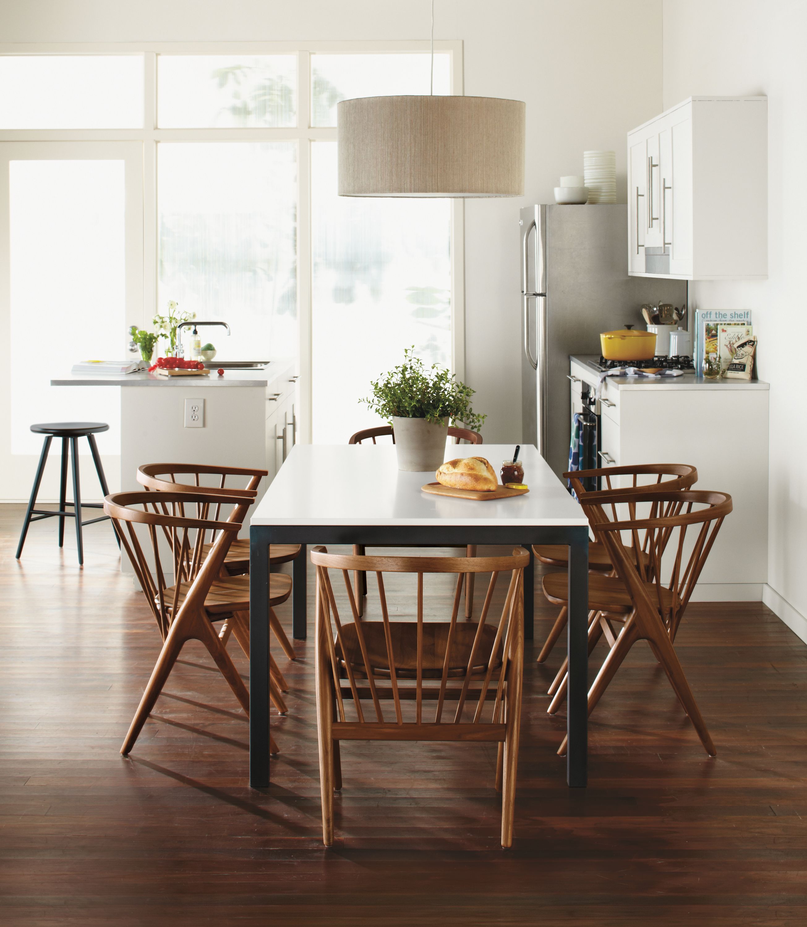 Dining setting with parsons 72-wide by 36-deep dining room table with white MDF top and Soren dining chairs.