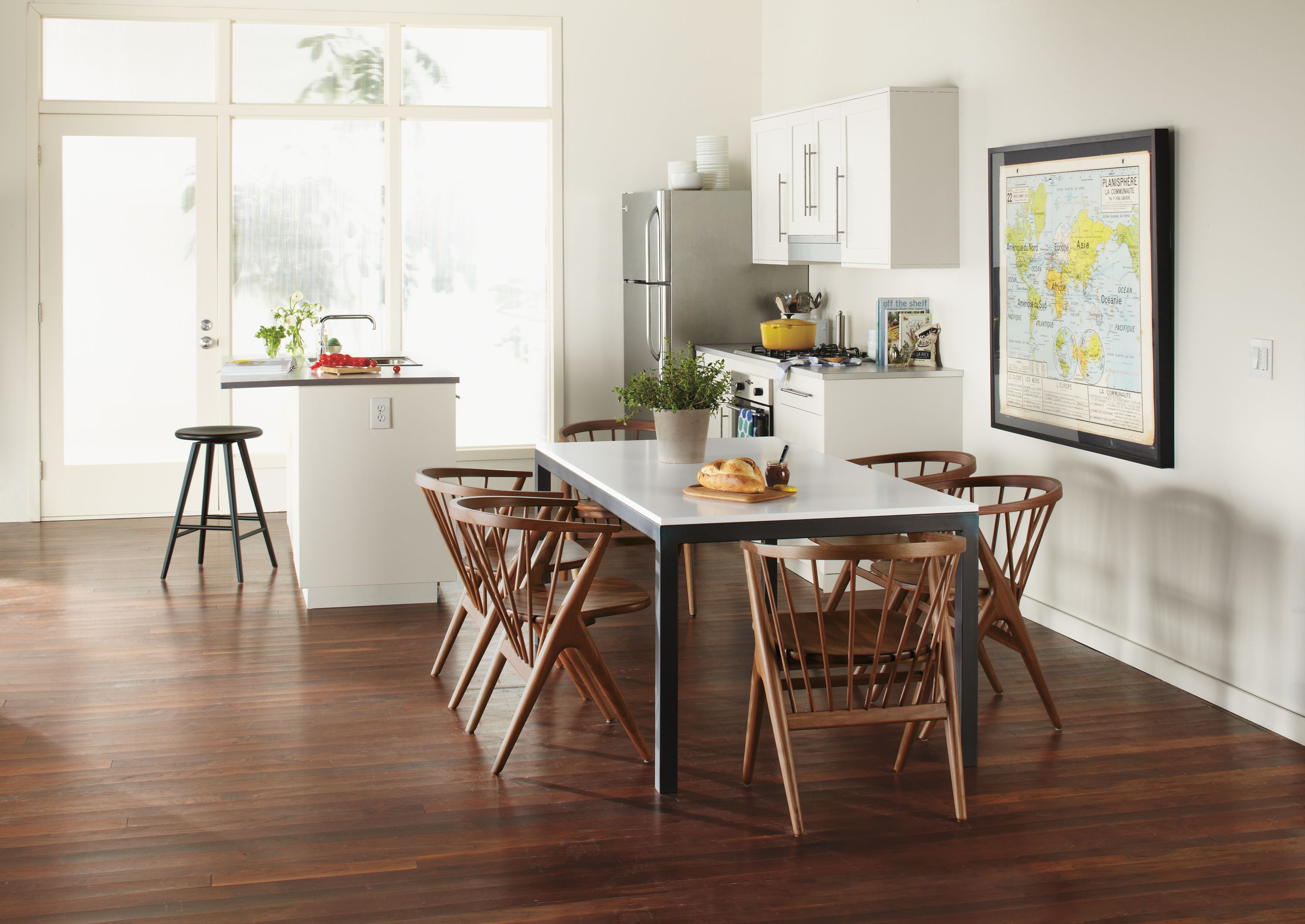 Dining setting with parsons 72-wide by 36-deep dining room table with white MDF top and Soren dining chairs.