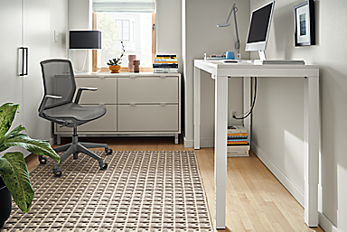 Office with Parsons 60-wide adjustable desk in white in standing position, Copenhagen cabinet and Cynara office chair.