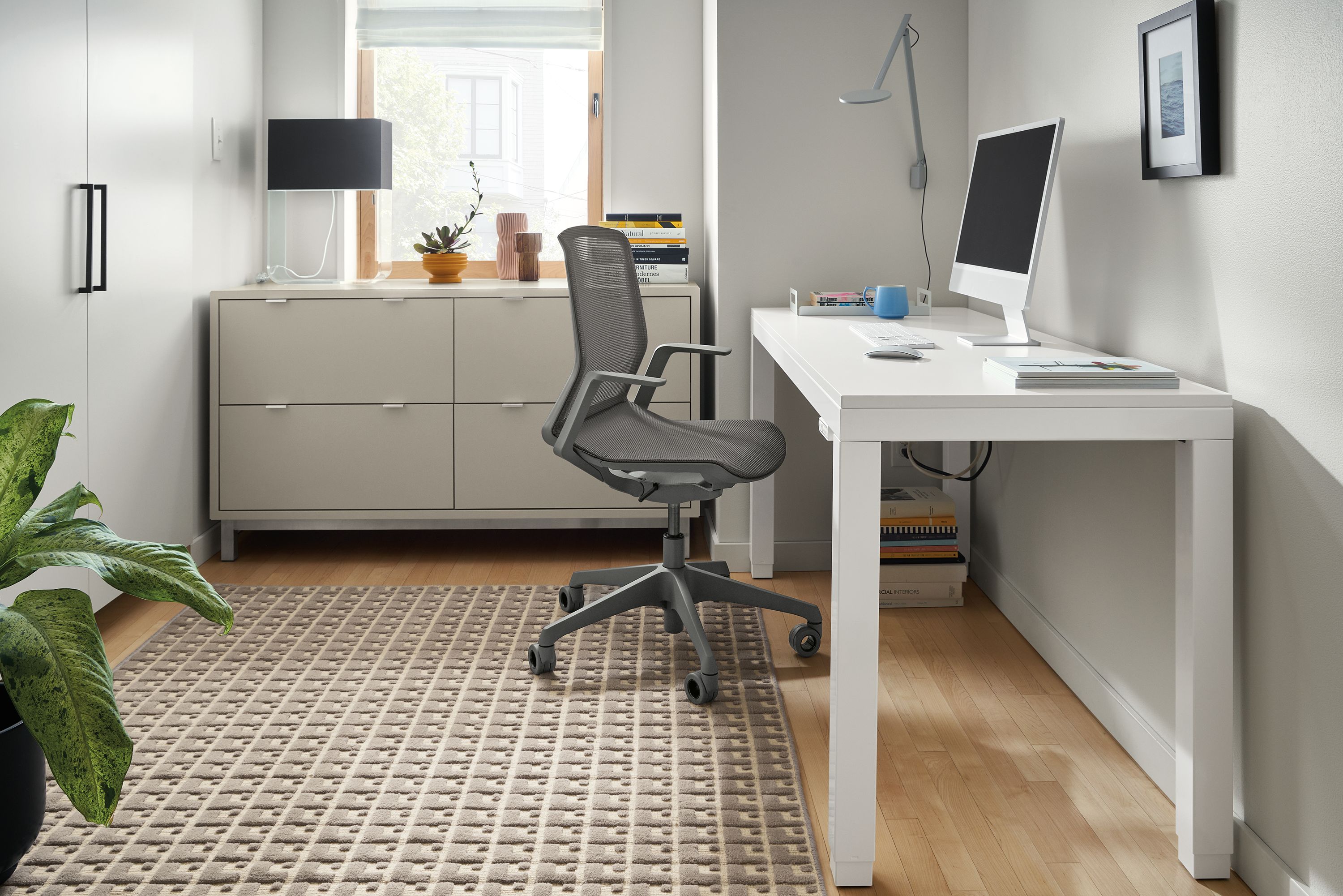 Office with Parsons 60-wide adjustable standing desk in white with white, Copenhagen 57-wide lateral file cabinet in taupe.