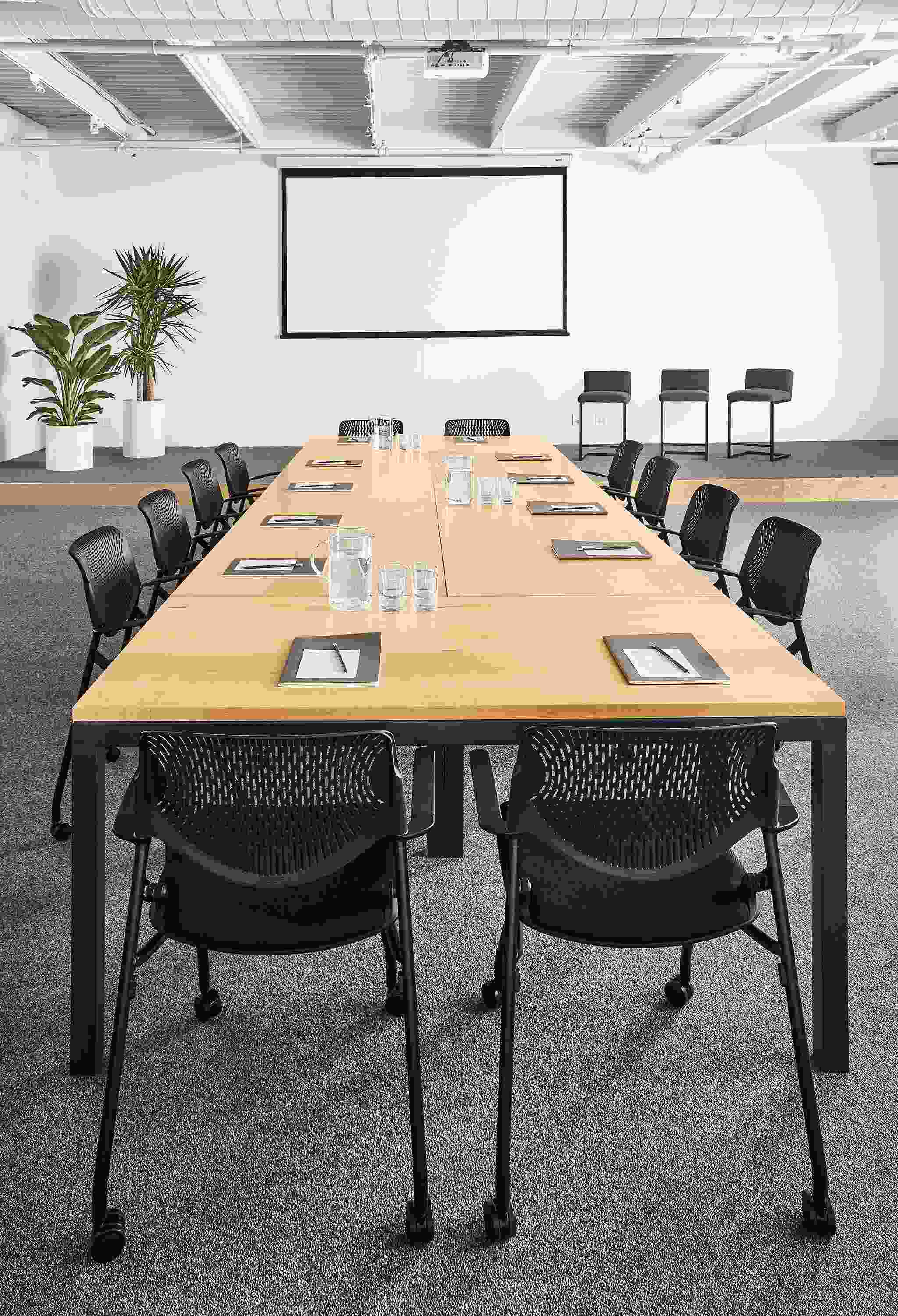 Detail of Parsons tables (6) in maple and graphite in conference room setting all pushed together.