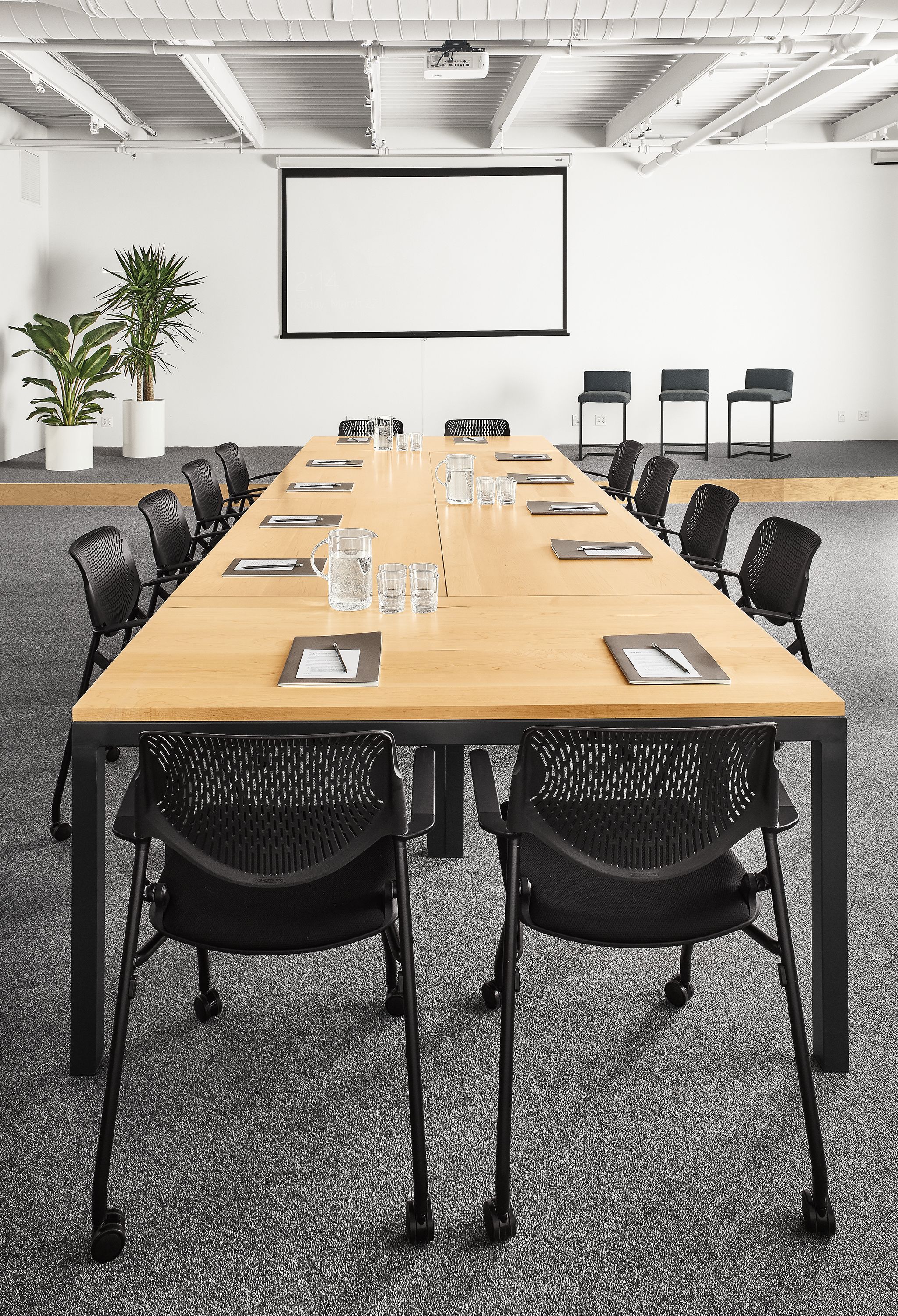 Detail of Parsons tables (6) in maple and graphite in conference room setting all pushed together.