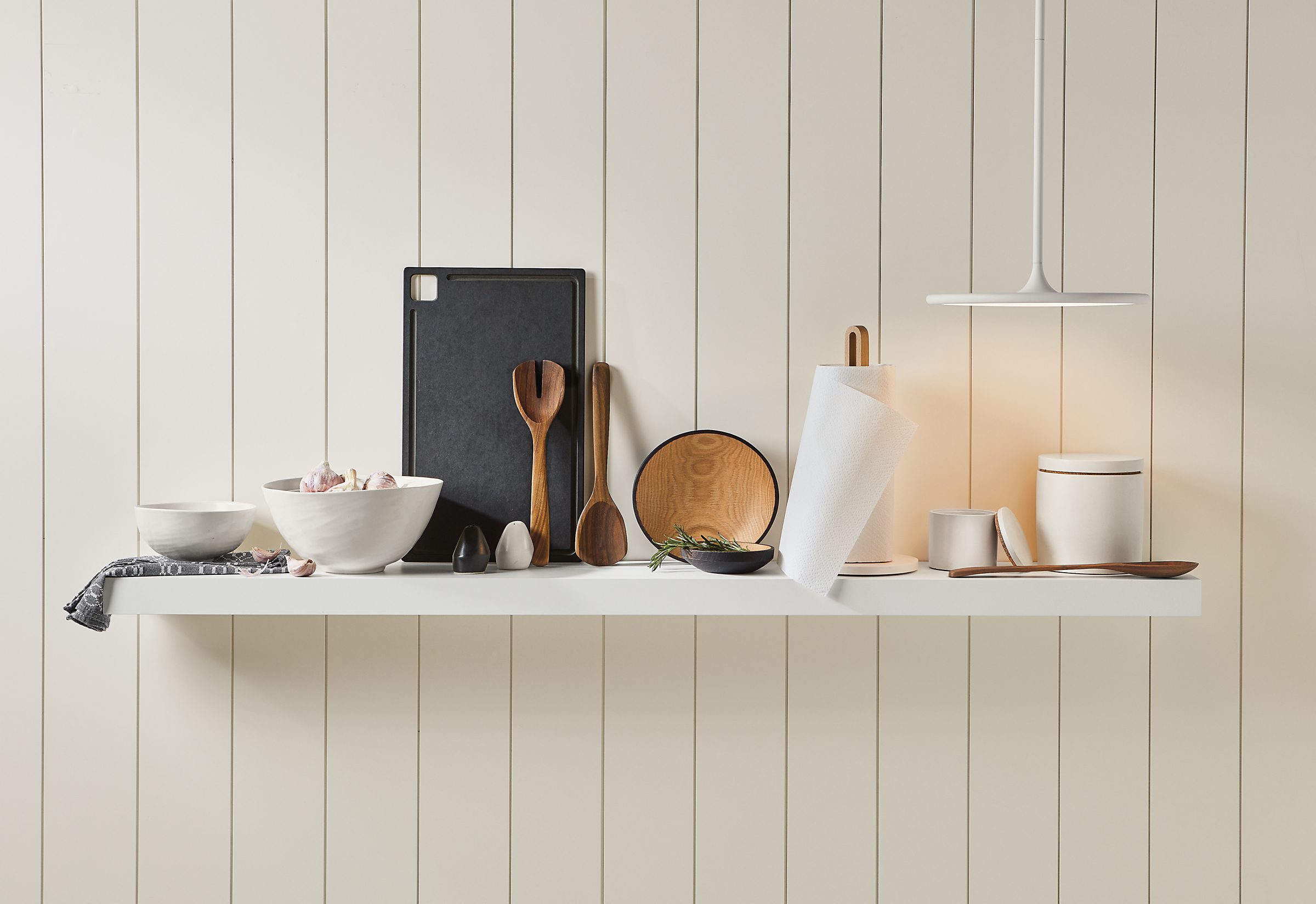 Kitchen setting with Anya bowls in white and a variety of kitchen accessories.