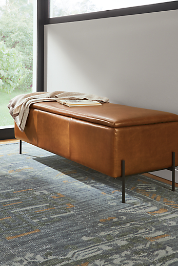 detail of paxton leather storage ottoman in entryway.